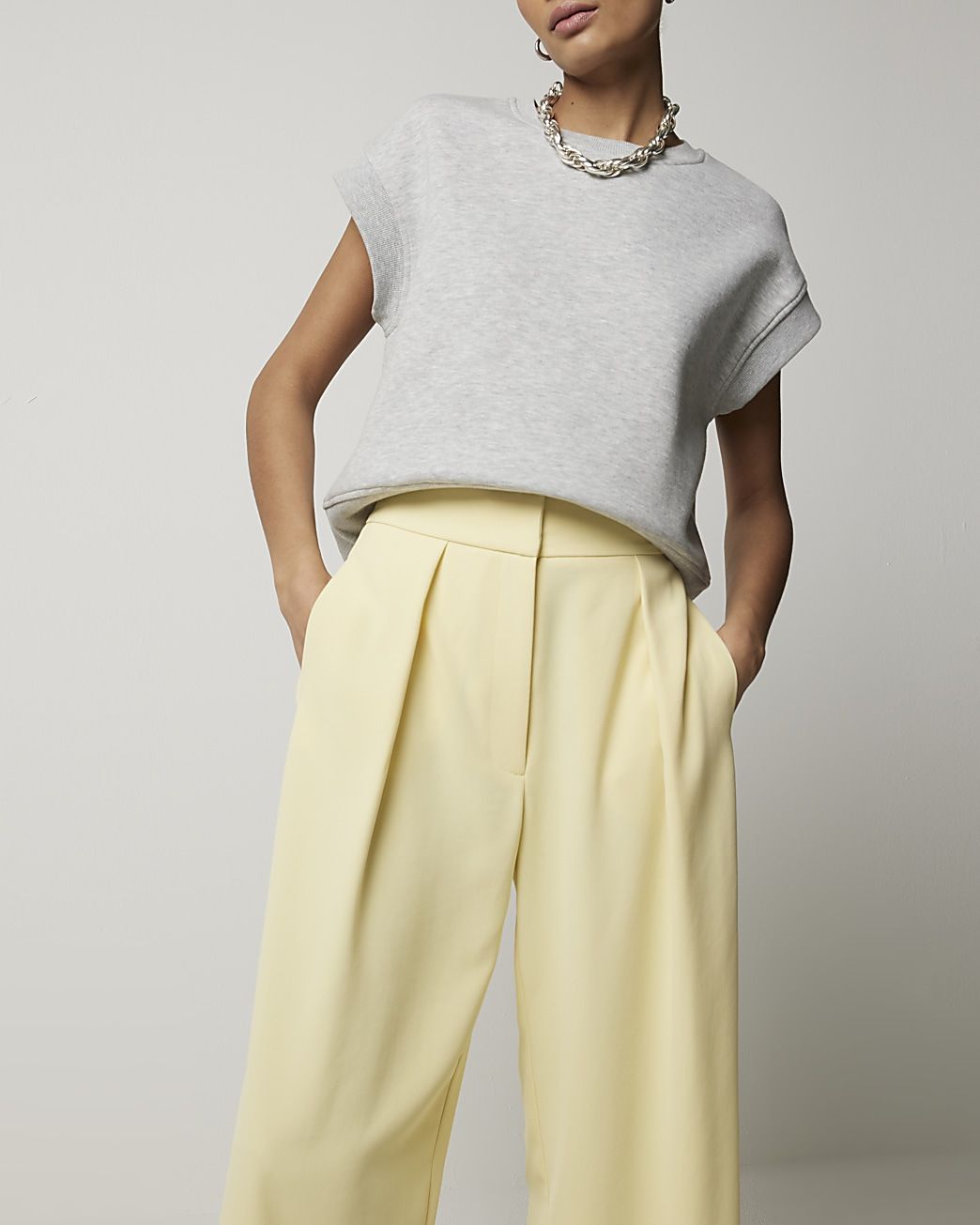 Yellow pleated wide leg trousers | River Island (UK & IE)