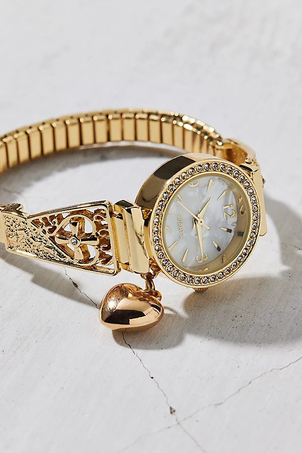 Heart Charm Round Face Metal Stretch Watch in Gold, Women's at Urban Outfitters | Urban Outfitters (US and RoW)