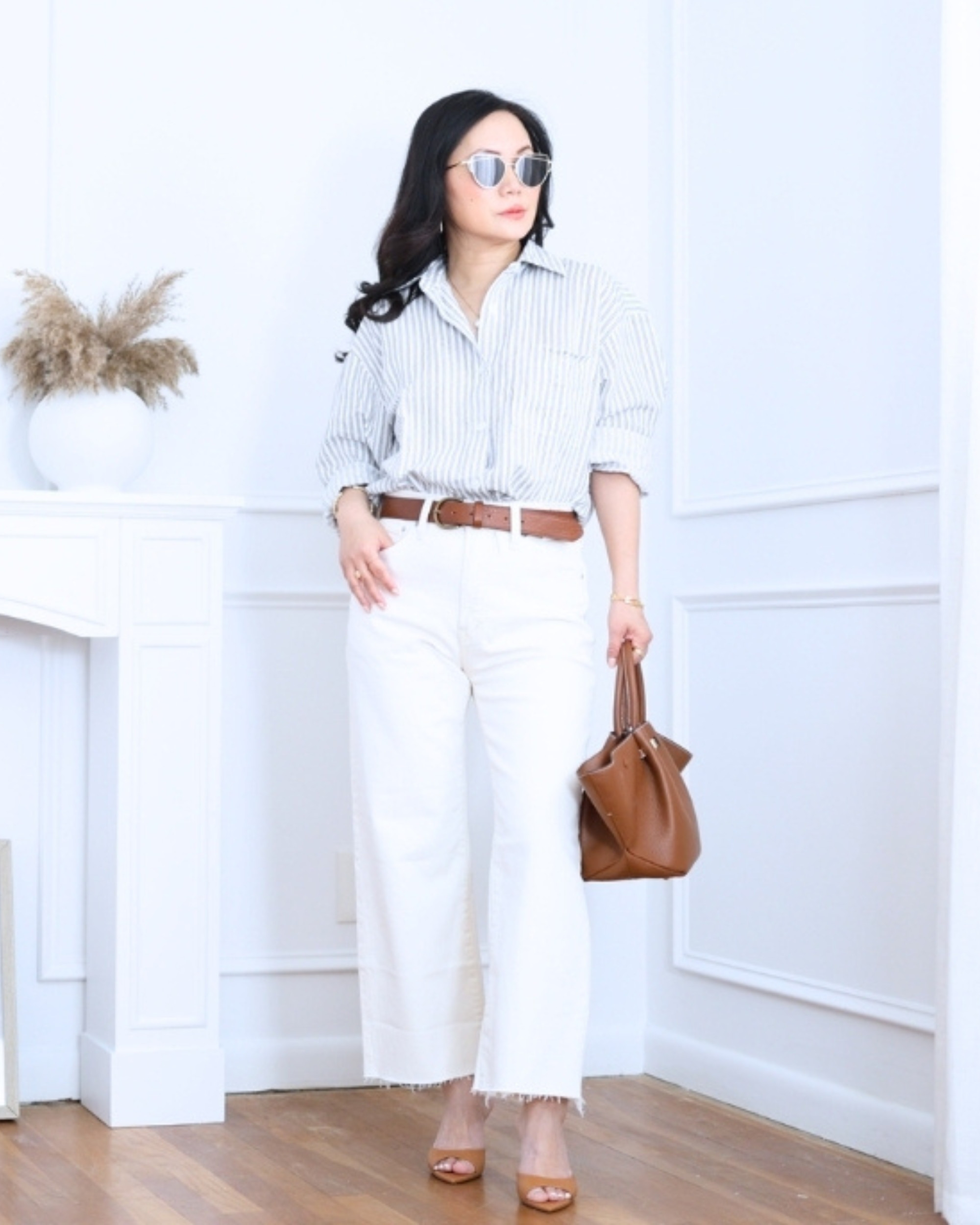 Striped shirt paired with white wide-leg jeans, both from Madewell — classic, relaxed, and effortlessly put together for an easy everyday look. I'm 5'2, wearing size S. 

 #LTKootd #LTKOver40 #LTKPetite