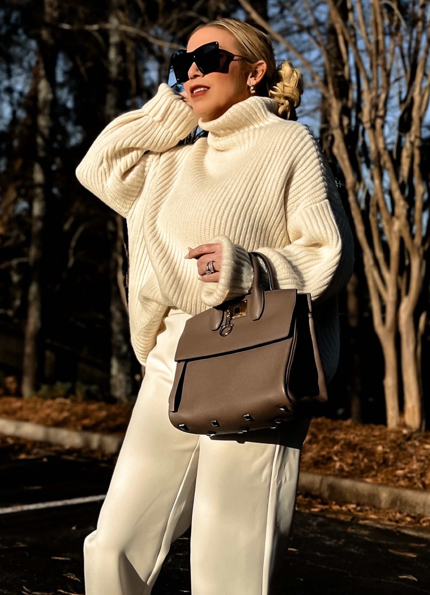 Winter Casual Chic Outfit
Ivory Cream Ribbed Funnel Mock Neck Oversized Sydney Sweater - Wearing a M
Ivory Cream Live In Luxe Wide Leg Pocket Pants - Wearing a S - Guys these pants are DREAMY! They also come in Olive Green and Black and the material is SO FAB. I ordered a second pair in every color!
Ivory Cream Snakeskin Adidas Original Superstar Sneakers
Taupe Ferragamo Small Studio Tote Bag ON SALE - Perfect Neutral Bag

#LTKsalealert #LTKover40 #LTKGiftGuide
