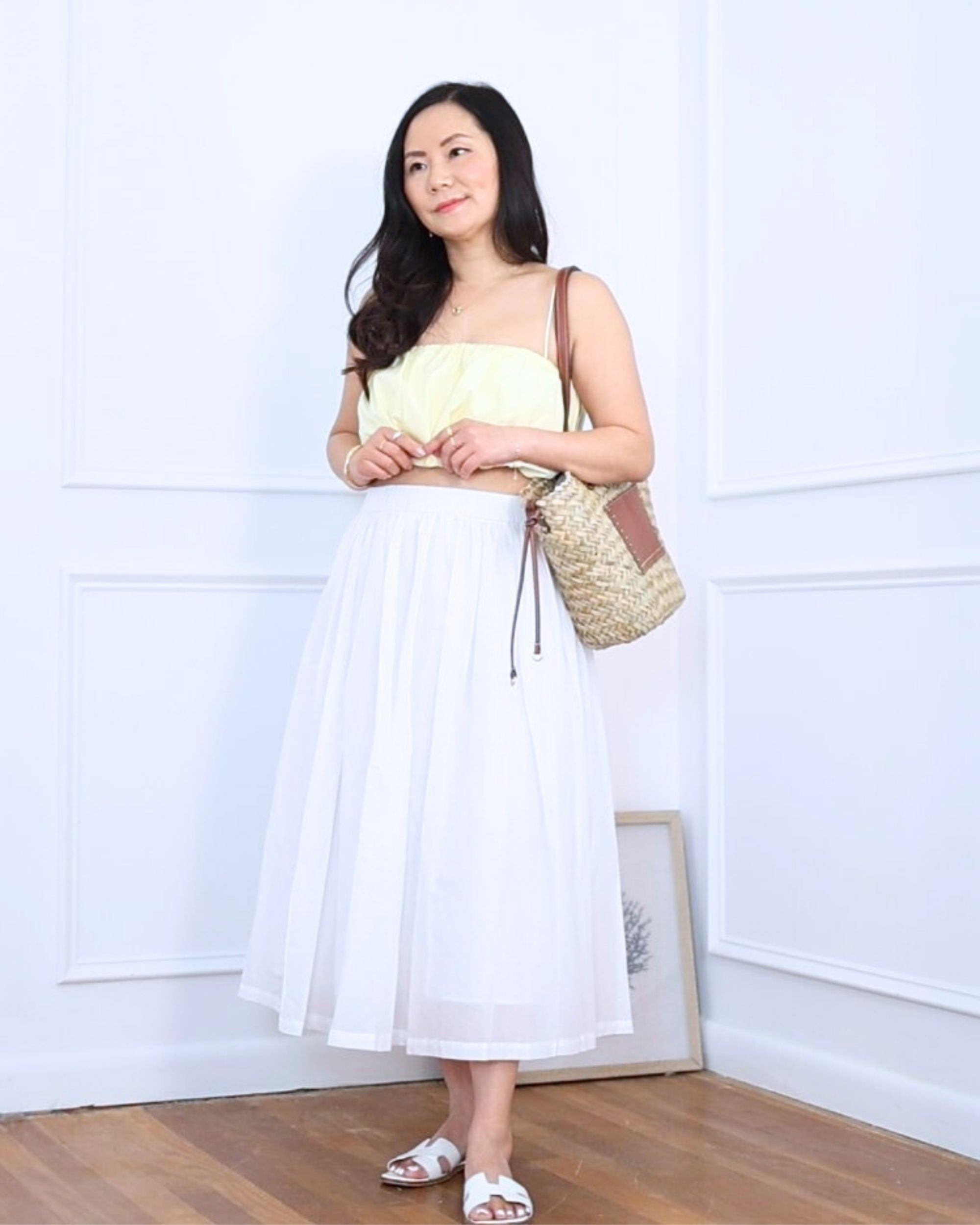 Wearing this butter yellow cami crop top from Abercrombie (S) with a white skirt, raffia tote bag from Mango, and flat sandals. This outfit feels so fresh and comfy! Just right for petites like me at 5’2”.

#LTKOver40 #LTKPetite #LTKStyleTip