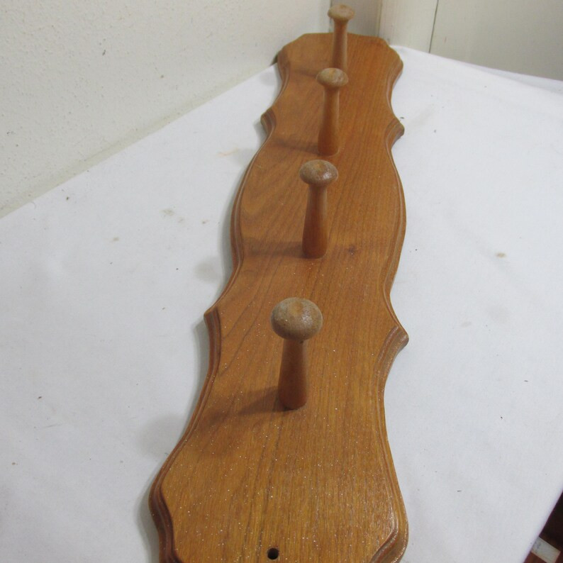 The decorative board has 4 three inch pegs to hang coats or even mugs.  24" L x 5" W.  It has dri... | Etsy (US)