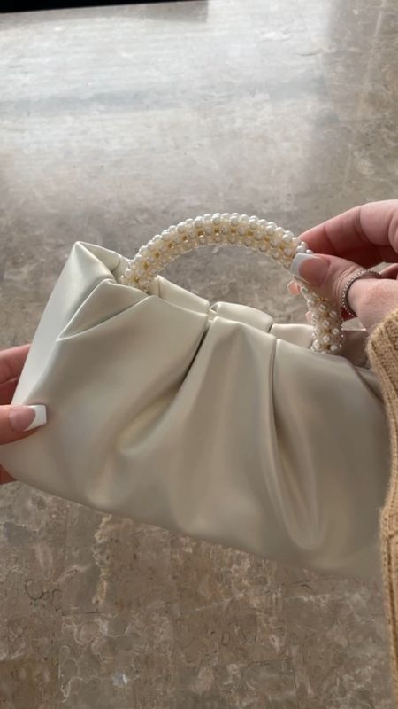 The cutest evening bag for under $20!! Perfect size for any little necessities you’d need to bring with you on your night out. Has attachable straps if you like a longer strap. The leather is really good quality and makes it look a lot more expensive than it actually is. I love the pearl details on the handle as well.🤍 comes in six different colors💕

#eveningpurse #leatherpurse 

#LTKfindsunder50 #LTKGiftGuide #LTKHoliday