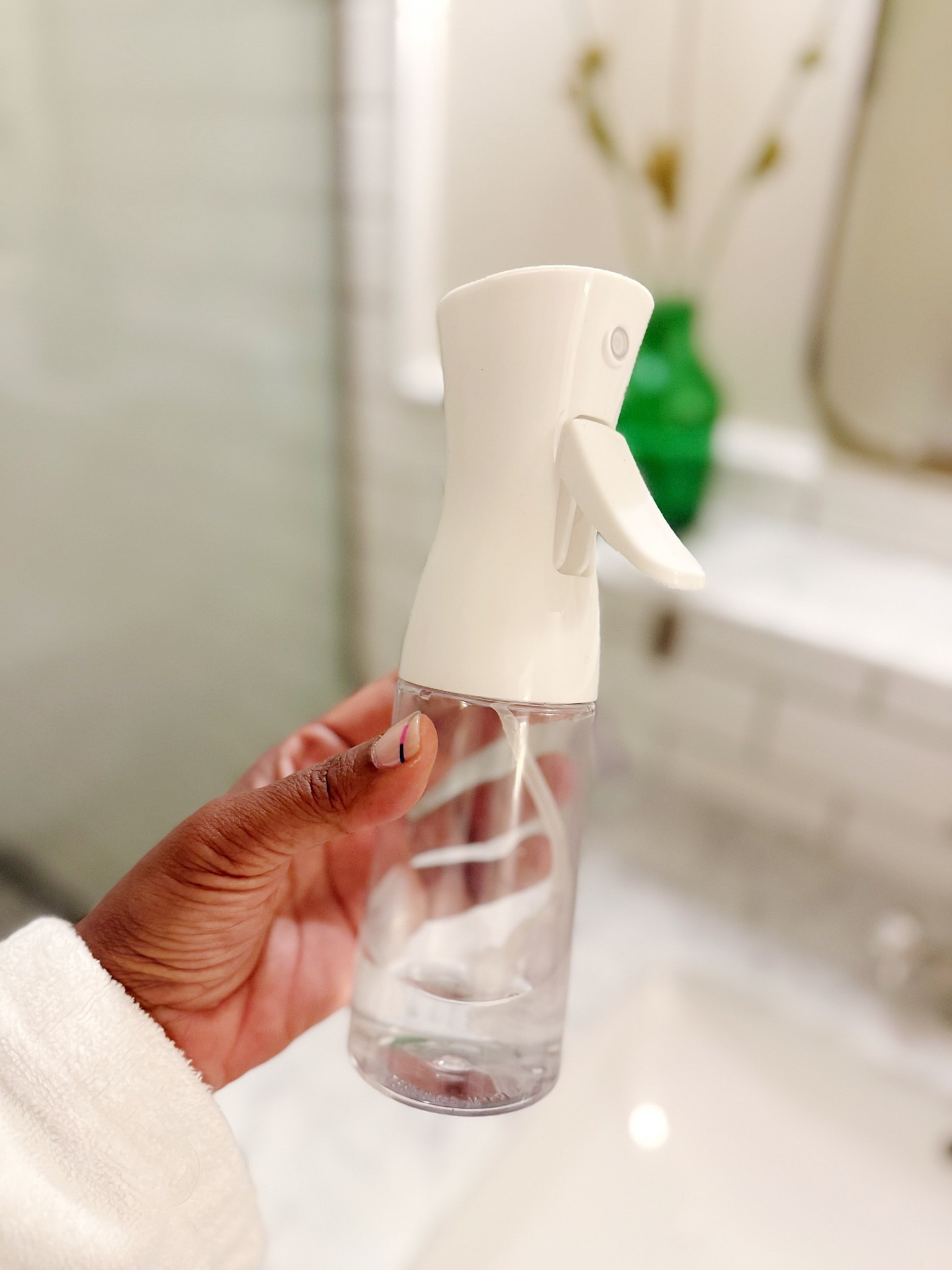 This is the spray bottle I travel with. It diffuses the water (or whatever product you put in it) which means that the water sprays out evenly over your hair without drenching it. Perfect to revive curls or slick hair back.

#LTKselfcare #LTKStyleTip #LTKFindsUnder50