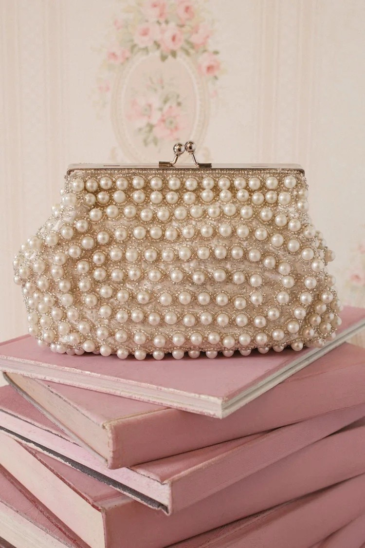 A touch of European evening glamour — delicate pearls, soft shimmer, and effortless sophistication. Under $50.

Keywords:

* pearl beaded clutch
* white clutch bag
* silver evening clutch
* beaded handbag
* bridal clutch
* formal clutch bag
* statement clutch
* elegant evening bag
* wedding guest accessory
* bridal outfit
* formal event outfit
* evening wear accessories
* date night bag
* special occasion styling
* luxury accessories
* event ready look
* soft glam aesthetic
* bridal chic style
* modern elegance
* timeless fashion
* quiet luxury
* refined feminine style
* subtle sparkle
* classic aesthetic

#LTKWedding #LTKgrwm #LTKTravel