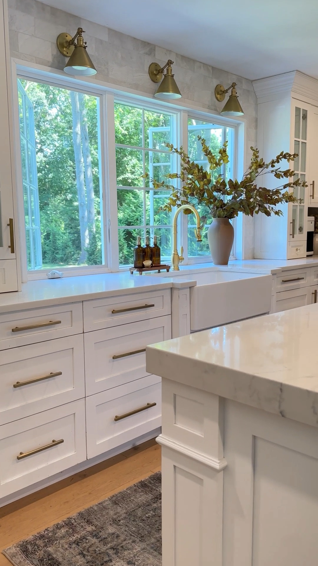 Kitchen lighting, backsplash, sink, faucet, area rug, cabinet hardware, artificial branches, vase. 



#LTKActive #LTKHome #LTKSaleAlert