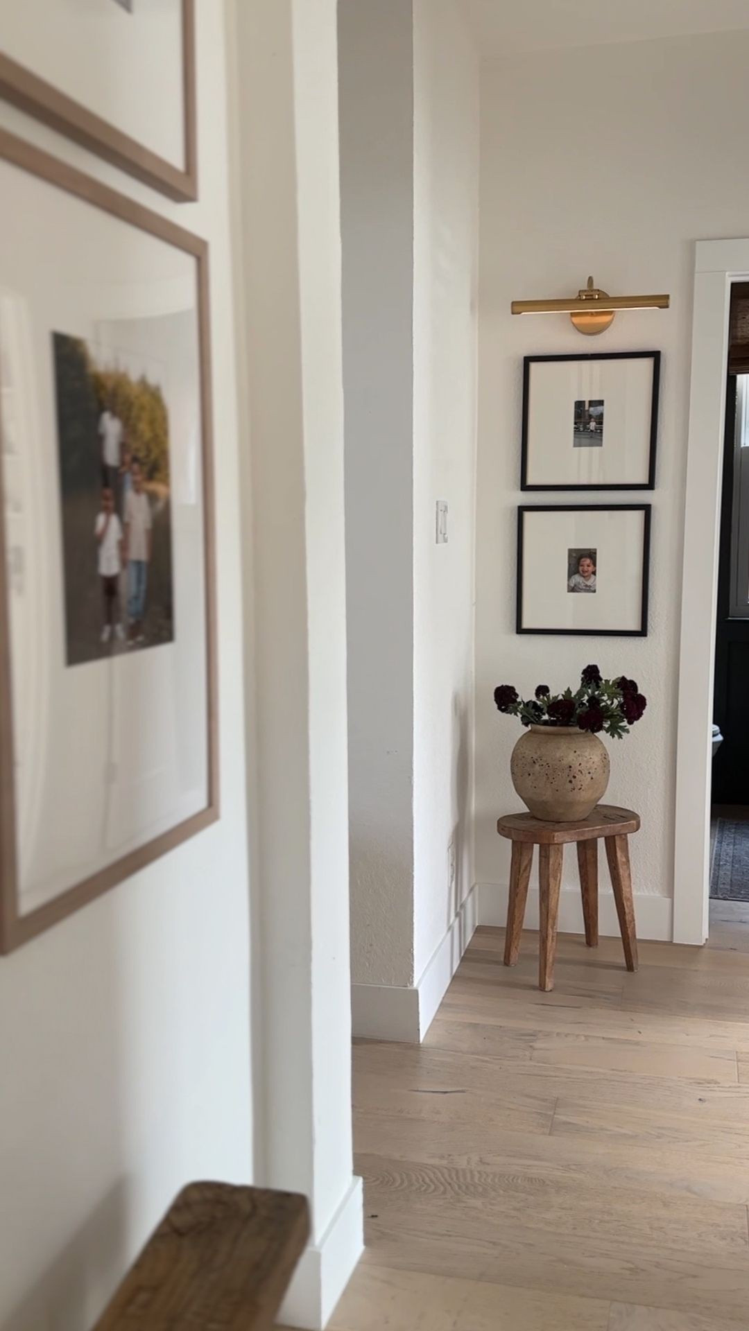 Easy way to jazz up an empty corner 🤎 vase and stems are hobby lobby!

Matted frames, picture light, accent stool, wood stool 

#LTKHome