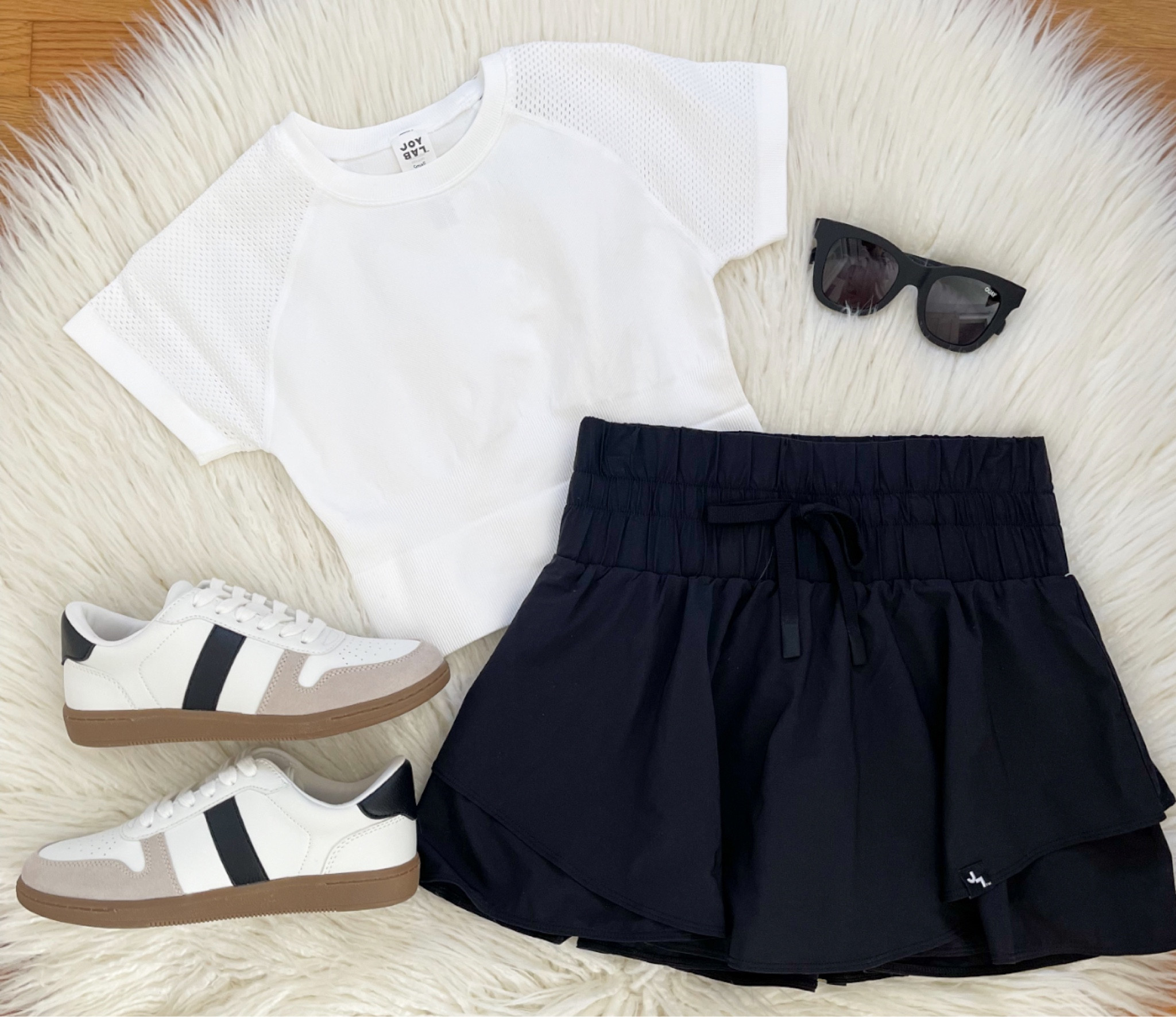 Happy Monday!  It’s warming up here so it’s time to share some NEW JoyLab Arrivals!  Love this flowy skort that also comes in green & white!  Styled it with this seamless JoyLab top & new sneakers for a fun athleisure look!  Check out my stories & bio for links 🖤

#LTKfindsunder50 #LTKstyletip