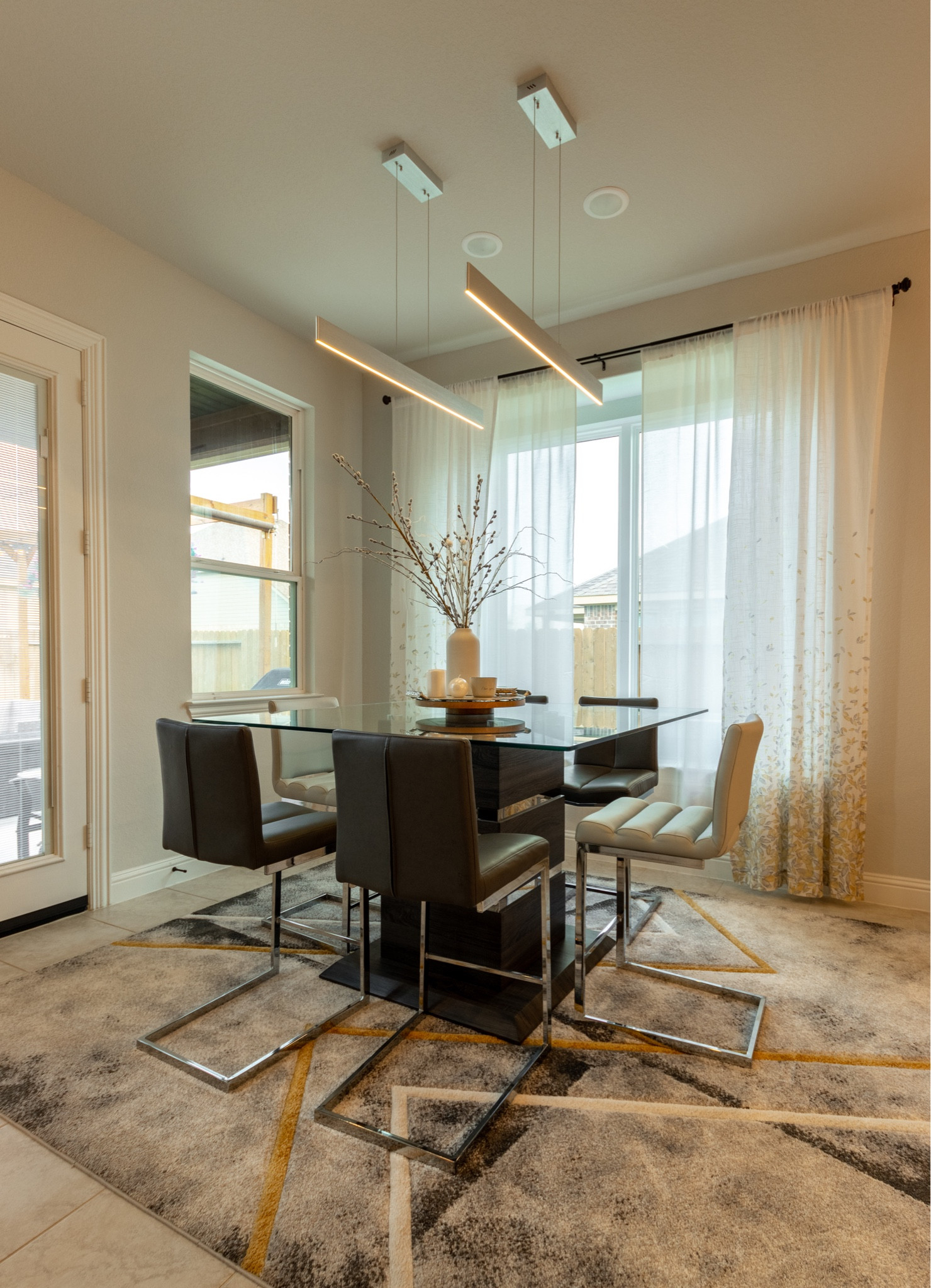 Bright and modern dining area. Love this lighting and the soft rug 

#LTKstyletip #LTKfamily #LTKhome