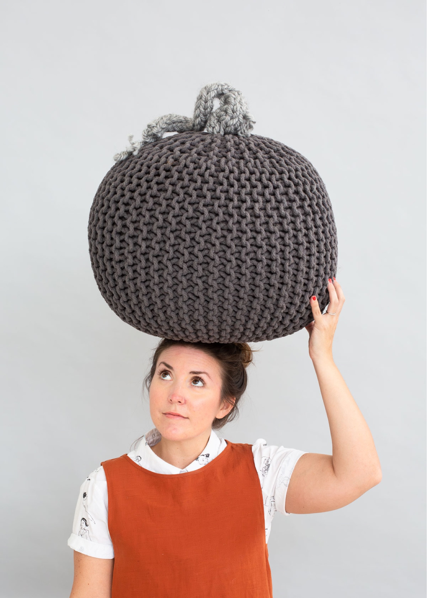DIY pumpkin idea - grab a knit pouf and finger knit a stem to make a unique and neutral piece of Halloween pumpkin decor. And when the holiday is over, remove the knit stem and use the pouf as normal. Halloween home decor - Halloween pumpkin idea

#LTKhome #LTKSeasonal #LTKHalloween