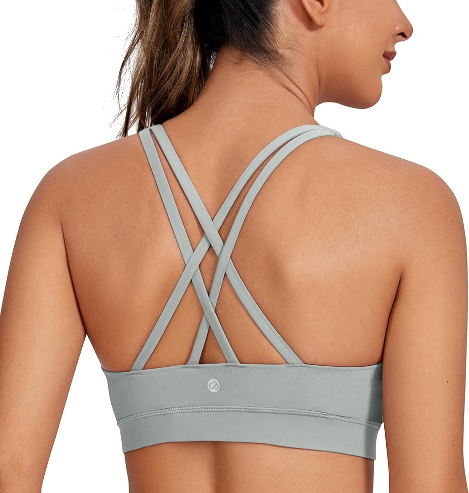 CRZ YOGA Women's Strappy Sports Bras Fitness Workout Padded Yoga Bra Criss Cross Back | Amazon (US)