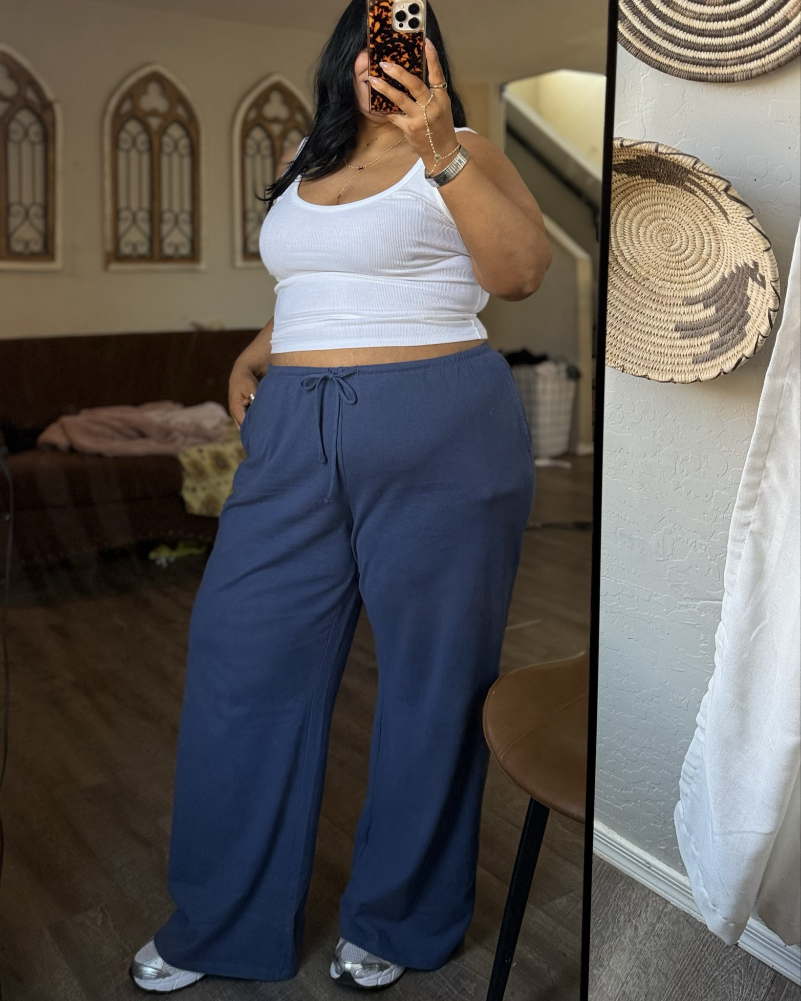 Easy weekend outfit for running errands. Sweatpants material is like old school 90’s cotton. These are my favorite tank tops I have them in black and white and they just fit so good! 5’6” XL 16/18 Wearing XL in top and bottom and shoes run tts 

#LTKootd #LTKMidsize #LTKPlusSize