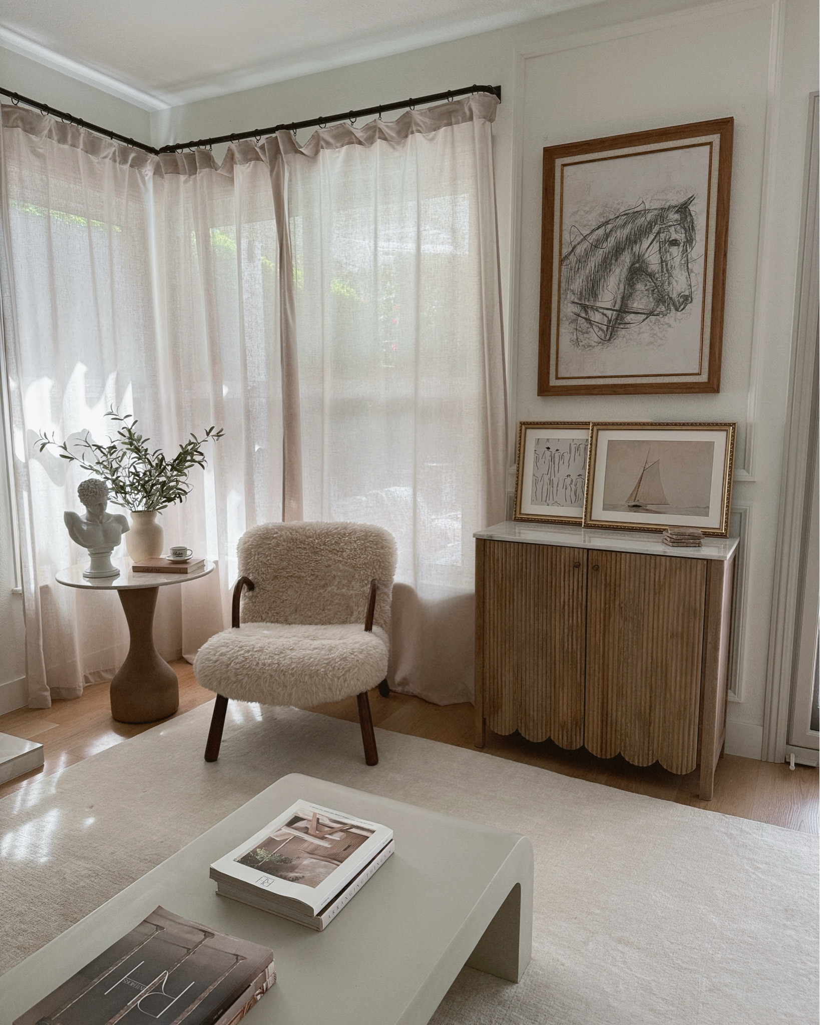 One of my favorite little corners because of this cutie chair! ✨🫶🏼
#ad #manhattanhomedesign

Living room • accent chairs • neutral home decor • side table • buffet • wall art 

#LTKHome