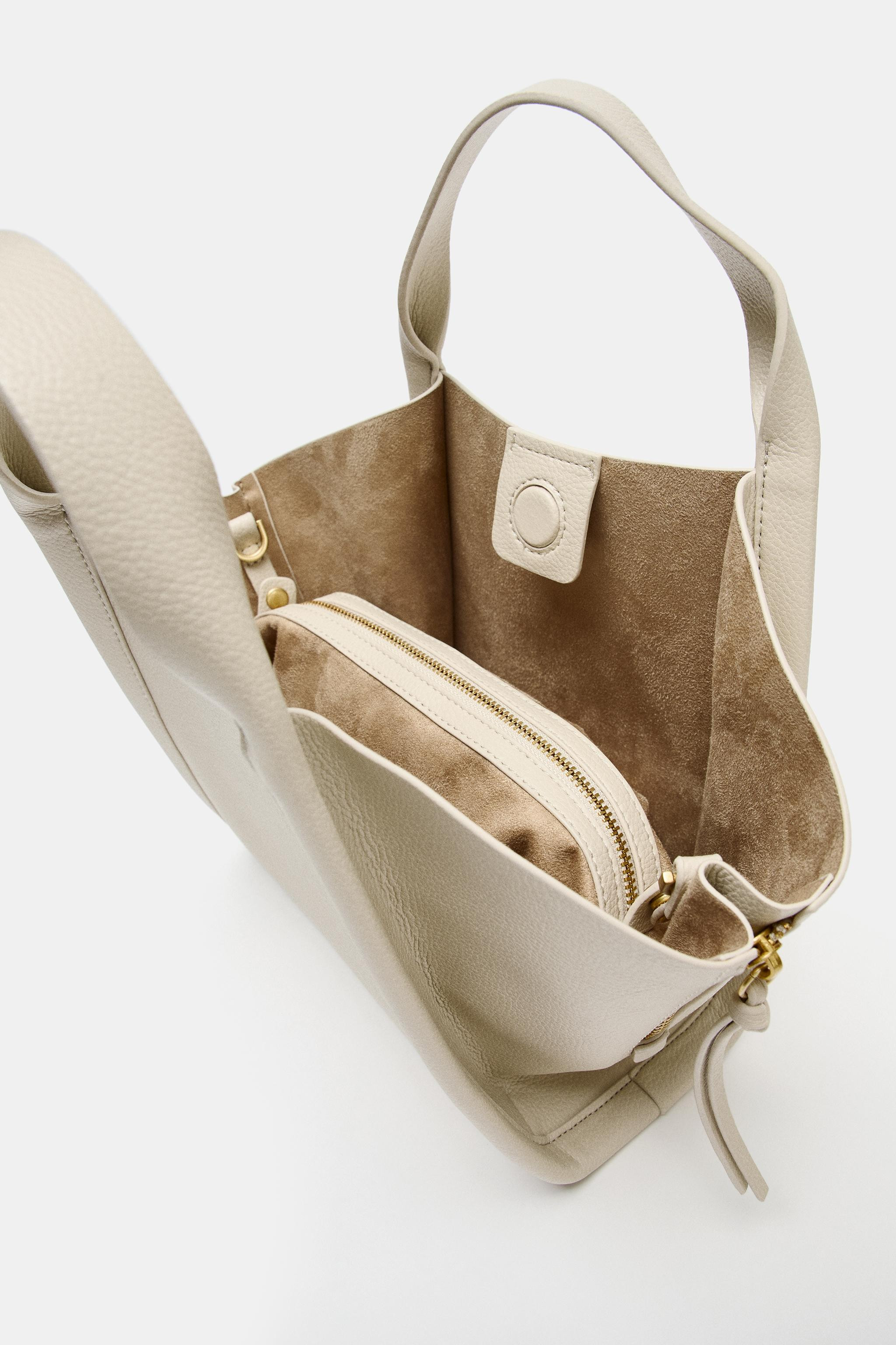 City crossbody bag. Stitching detail on the body. Side zippers with pull tabs. Double hand strap ... | Zara US