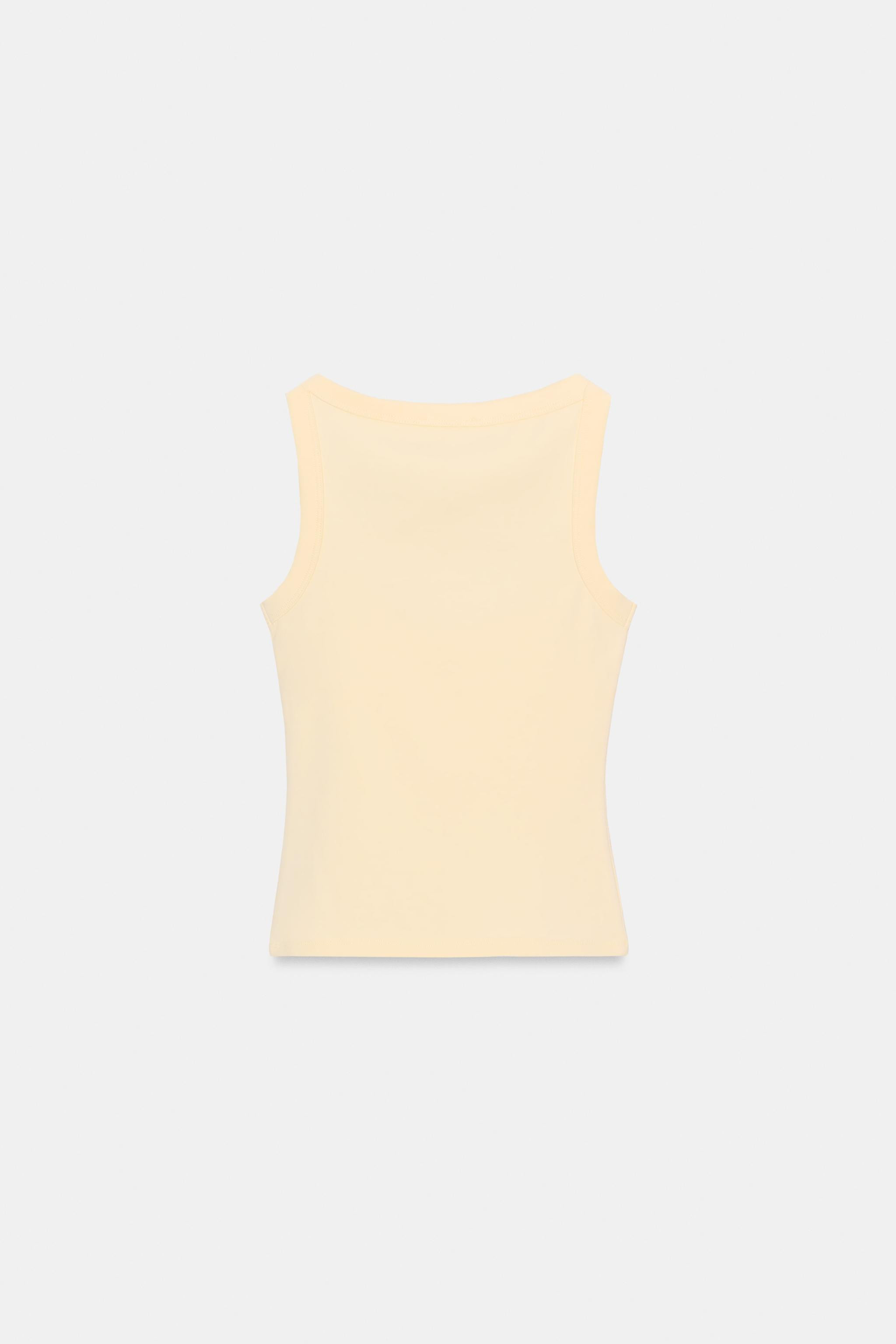 SLIM FIT - ROUND NECK - REGULAR LENGTH - SLEEVELESSSleeveless T-shirt made from a cotton blend ya... | Zara IT