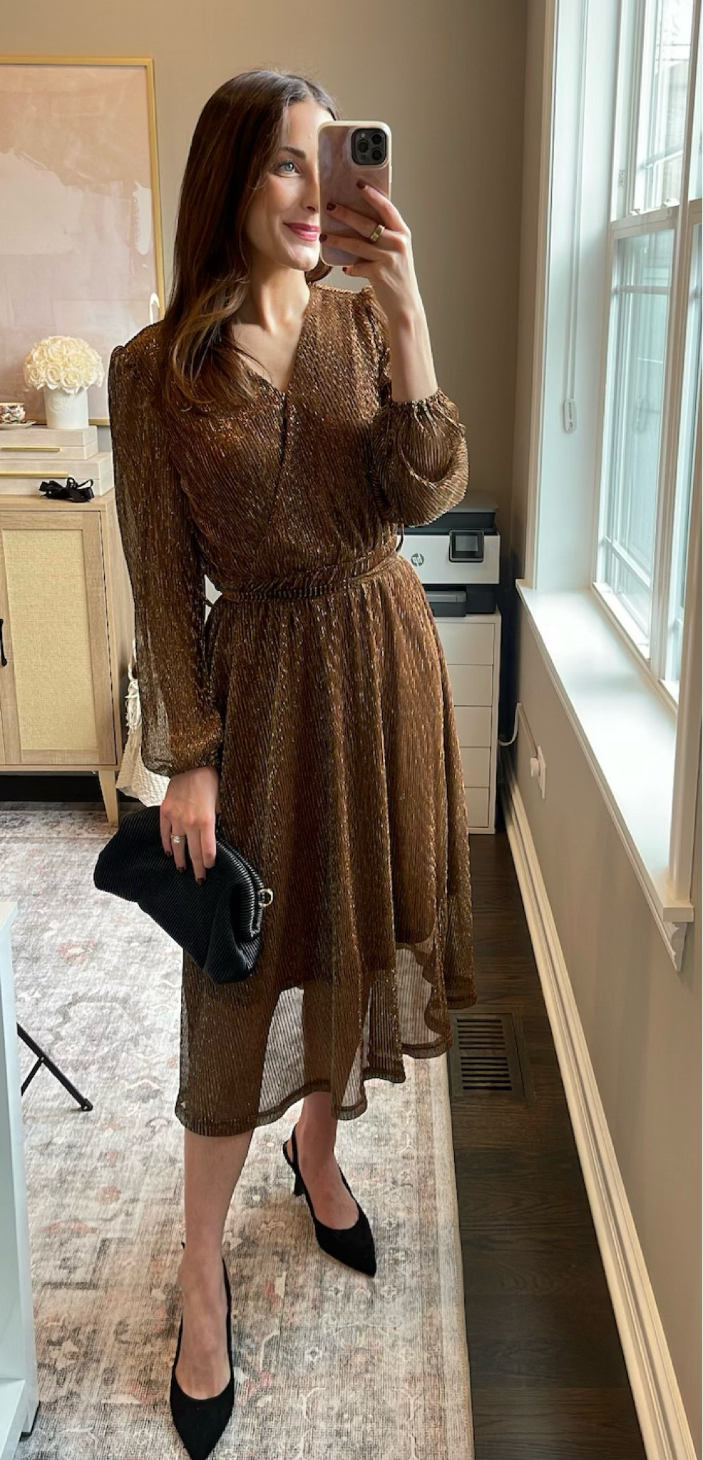 Holiday party outfit! I am wearing a small in the dress at 5'4.5. Shoes fit TTS.

Items include a gold flowy dress, a black clutch, a black pair of heels 

#LTKstyletip #LTKfindsunder100 #LTKSeasonal