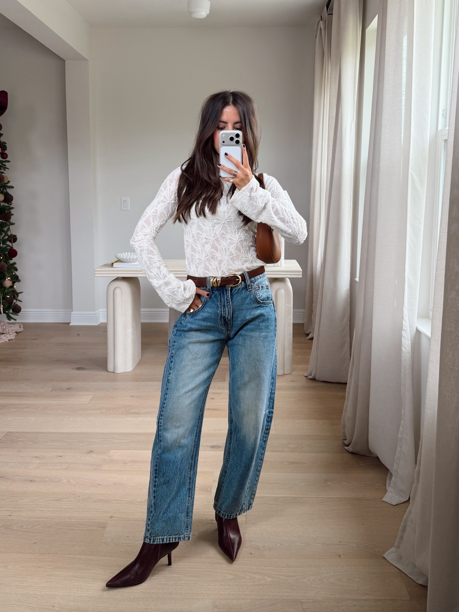 Size down two sizes in jeans. I’m wearing 00