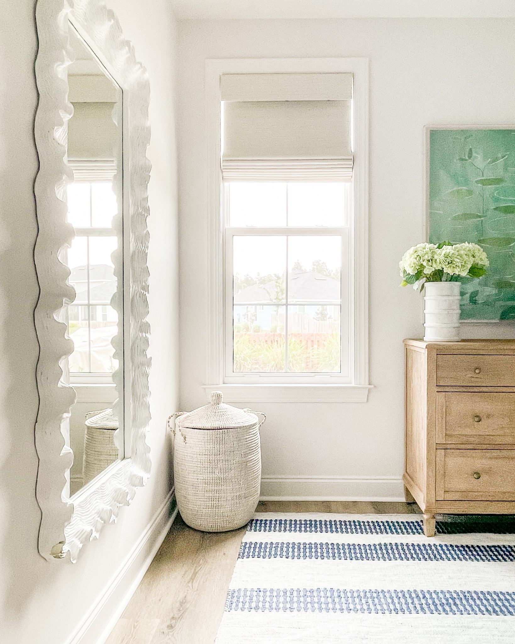 We finally hung this mirror in our bedroom, after it sitting on the floor for a month or two. I still need to fix the corner that snapped off in shipping but we’re loving how it updated our bedroom! Also linking our striped rug, light wood dresser, colorful lily art, marble vase, faux hydrangeas (these are the light green option) and woven laundry basket.
.
#ltkhome #ltkseasonal #ltksalealert #ltkunder50 #ltkunder100 #ltkstyletip #ltkfind primary bedroom decor, spring decorating 

#LTKhome #LTKSeasonal #LTKsalealert
