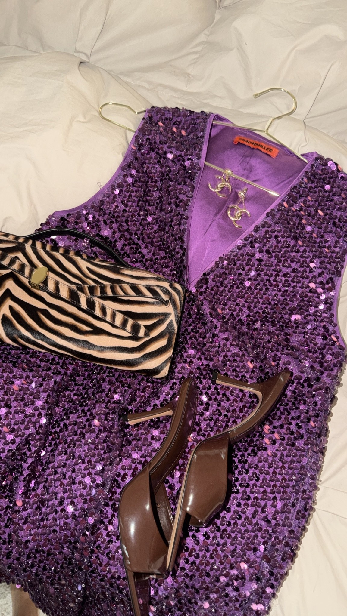 what i’m wearing for robbie’s birthday dinner! curvy midsize purple sequin dress 💜 size large! andddd obsessed with the zebra clutch