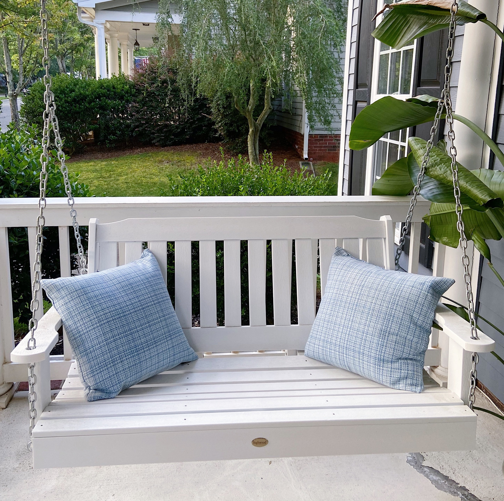 Our porch swing from Wayfair. The perfect way to spend a summer evening outside. | blue outdoor pillows | plastic porch swing | front porch furniture | outdoor furniture | Wayfair sale

#LTKSeasonal #LTKsalealert #LTKhome