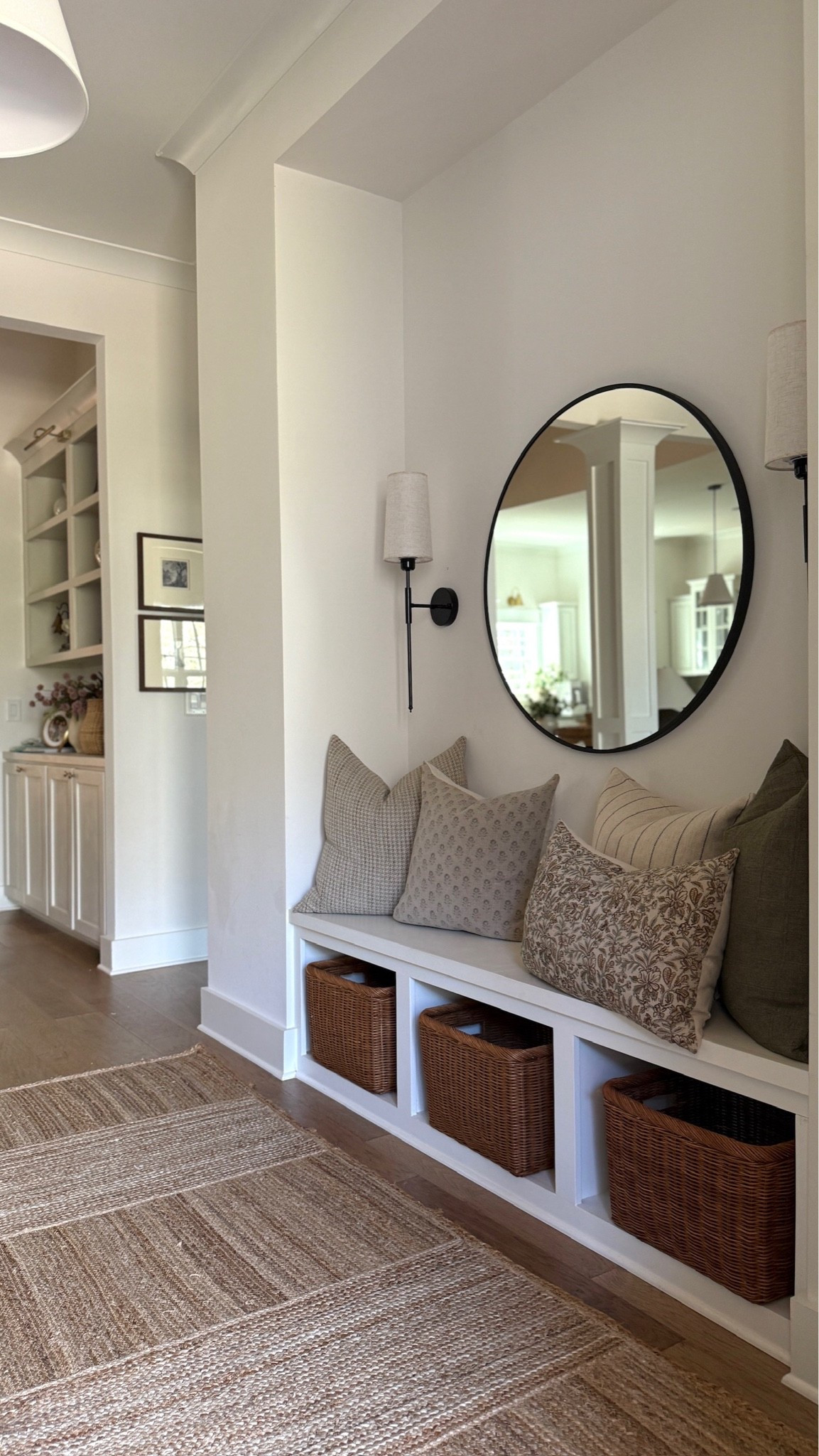 An abundance of patterned throw pillows makes this modern entryway space feel so cozy and curated 🤍

#LTKHome