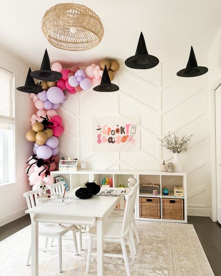 Halloween playroom! 
Hanging witches hats, balloon garland, hair spiders, skeletons, Halloween decor, spooky decor for kids, toddler play table, playroom rug, playroom storage

#LTKkids #LTKHalloween #LTKhome