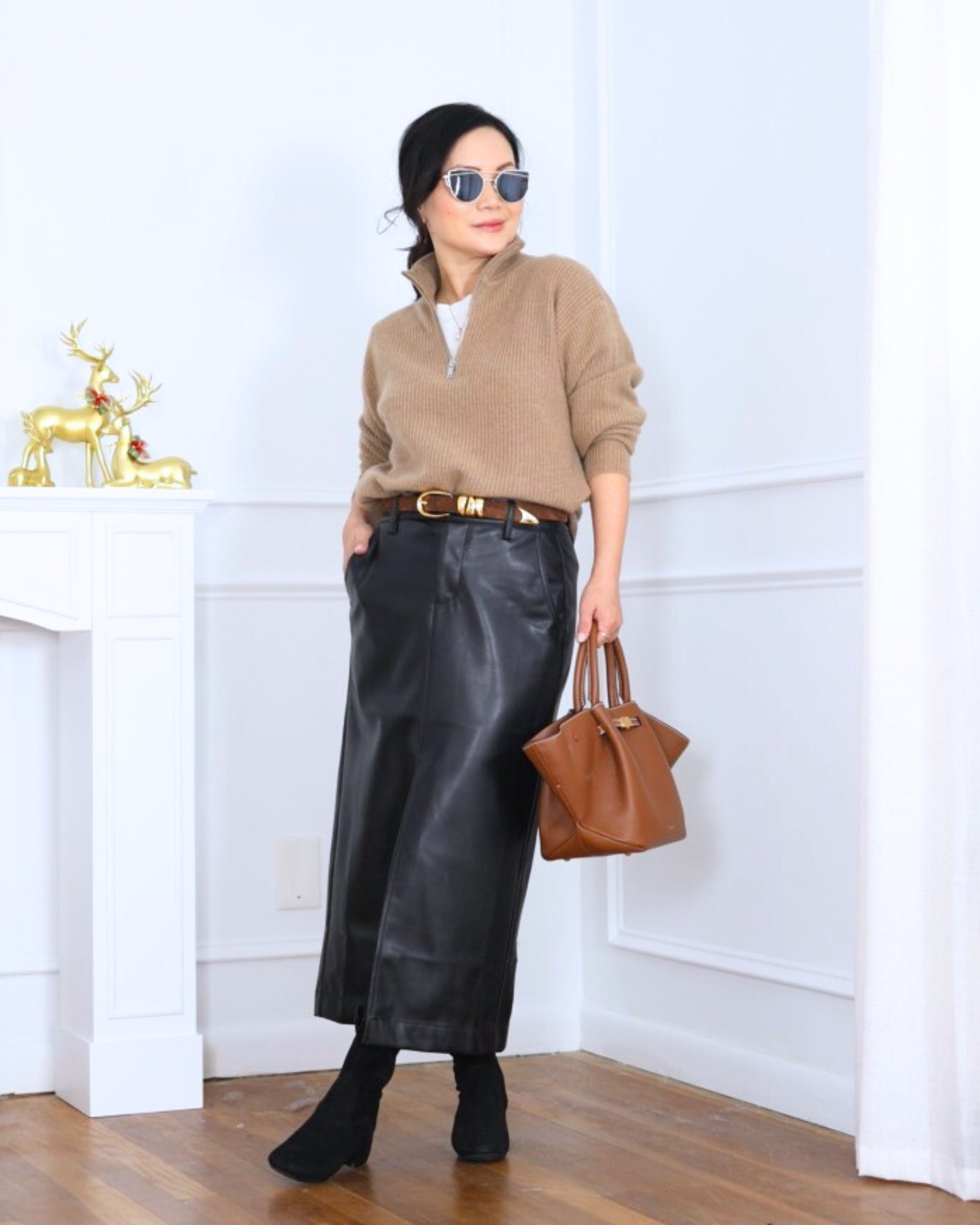 Cashmere quarter-zip sweater from Quince paired with a faux leather skirt from LOFT and booties—cozy up top, a little edge on the bottom, and an easy outfit that feels put-together without trying too hard. I’m 5’2, wearing size XS.

#LTKPetite #LTKootd #LTKOver40