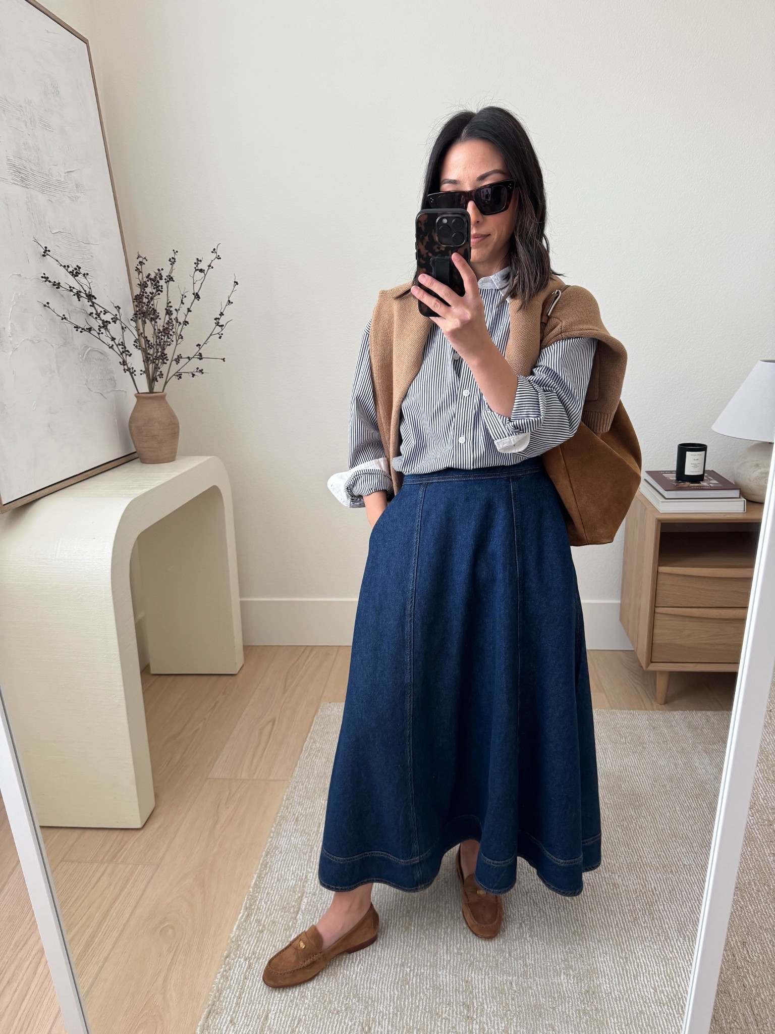Thanksgiving 2025 outfit idea.

I love a denim midi skirt in the fall - they're so versatile just like jeans! This one is old Reformation, but going to link a few similar. 

J.Crew striped button down 4
Reformation denim skirt small
Veronica Beard loafers 5.5, but run tts
J.Crew lady cardigan small
Liffner shoulder bag
Celine sunglasses

Fall outfits, fall style, Thanksgiving outfit, holiday style 

#LTKSeasonal #LTKHoliday #LTKPetite