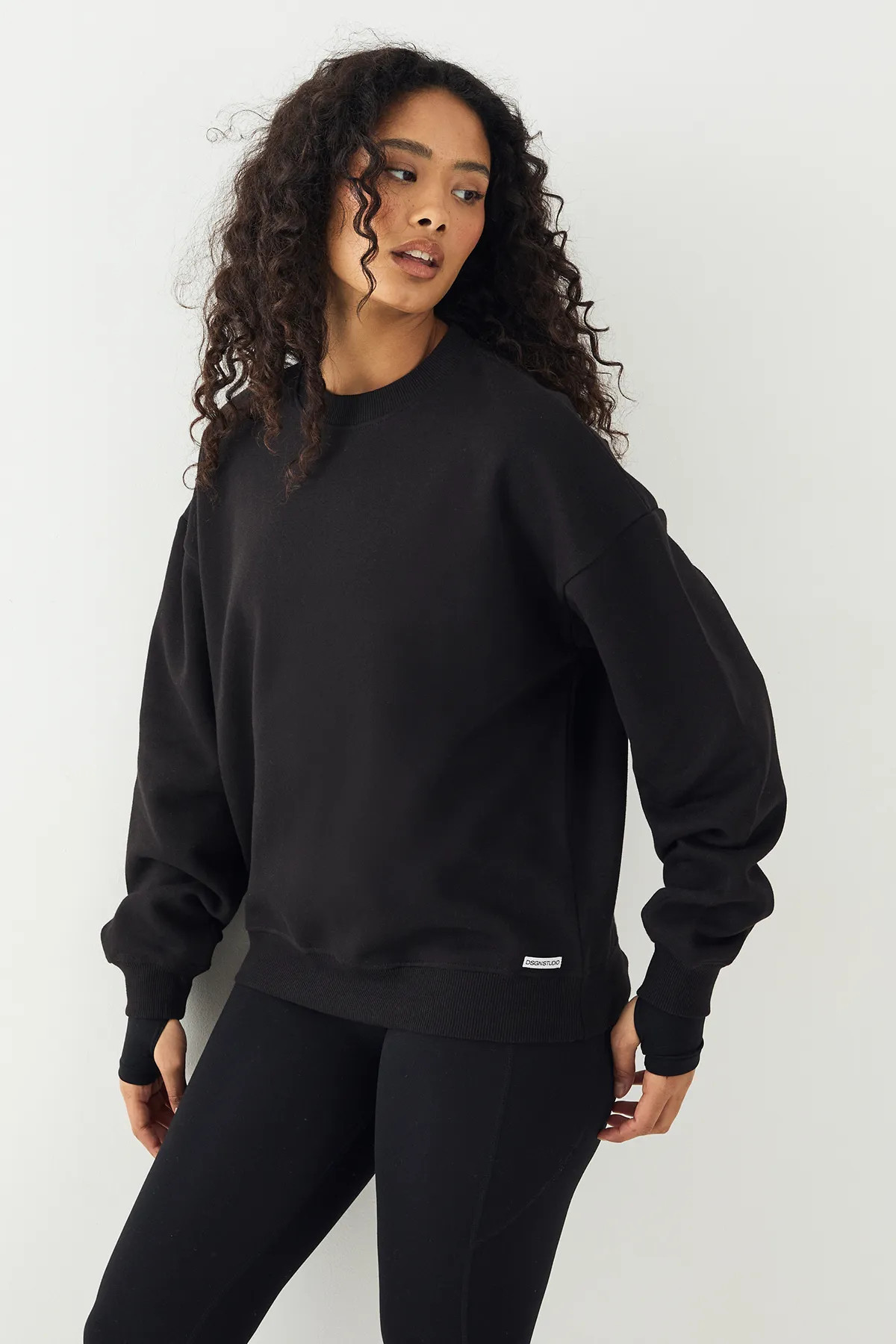 Black DSGN Studio Crew Neck Oversized Sweatshirt | PrettyLittleThing USA | PrettyLittleThing US