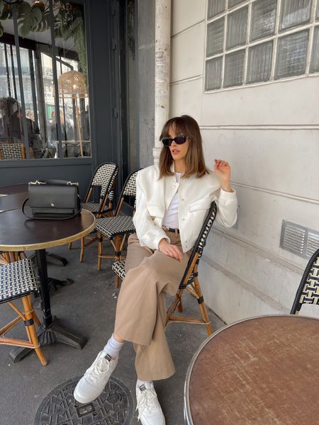 Beige bomber jacket, white top, brown straight formal trousers, white trainers, black sunglasses, black belt

#LTKeurope #LTKstyletip #LTKSeasonal