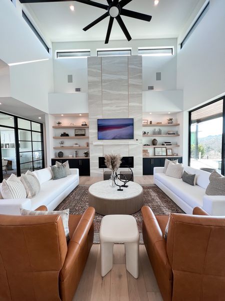 Modern living room
Neutral
White couch
Leather chairs