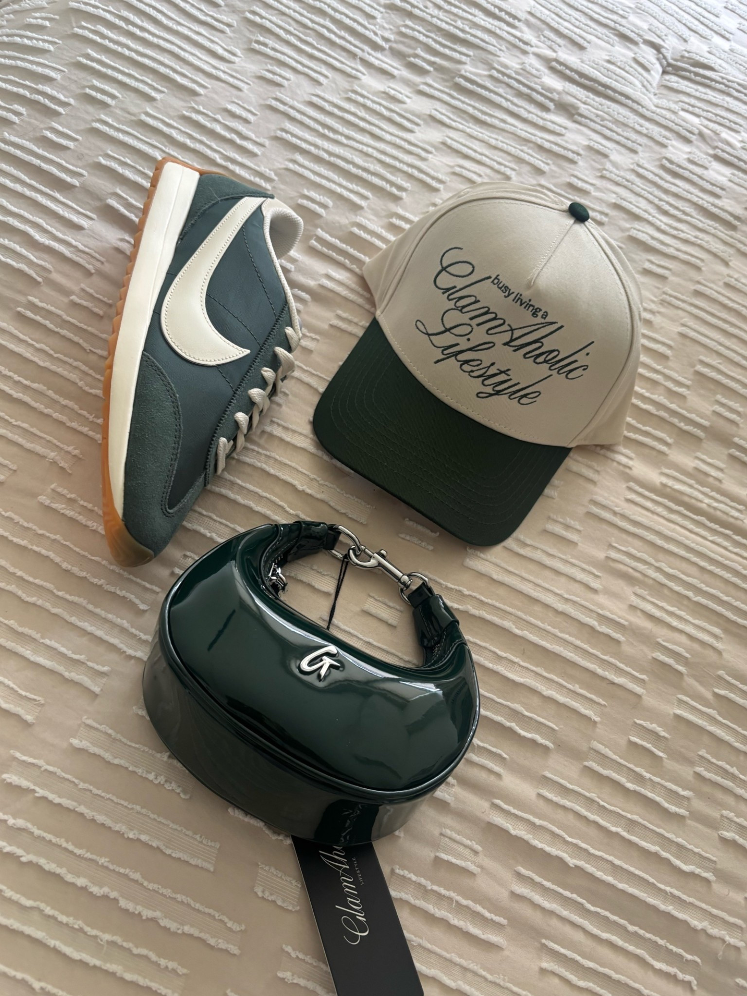 The girls who know how to accessorize know a good bag changes EVERYTHING. 

This whole combo feels like the perfect mix of sporty, street style, and affordable luxury without trying too hard.

Nike sneakers, a statement hat, and this green patent nano bag? Such an easy way to make a simple outfit feel styled and intentional.

And honestly, this bag is what really pulls the look together. The fact that it can be worn as a crossbody, wristlet, or even styled as a bag charm makes it one of those accessories that works for so many different moments.

Concerts, festivals, summer events, vacations, casual date nights, running around the city… it’s giving cool girl energy every single time.

Plus it’s under $100, which honestly makes it even better because it gives designer-inspired vibes without the luxury price tag.

Linking everything because if you’ve been looking for accessories that instantly make casual outfits feel more elevated and put together, this combo is SO good.

#LTKootd