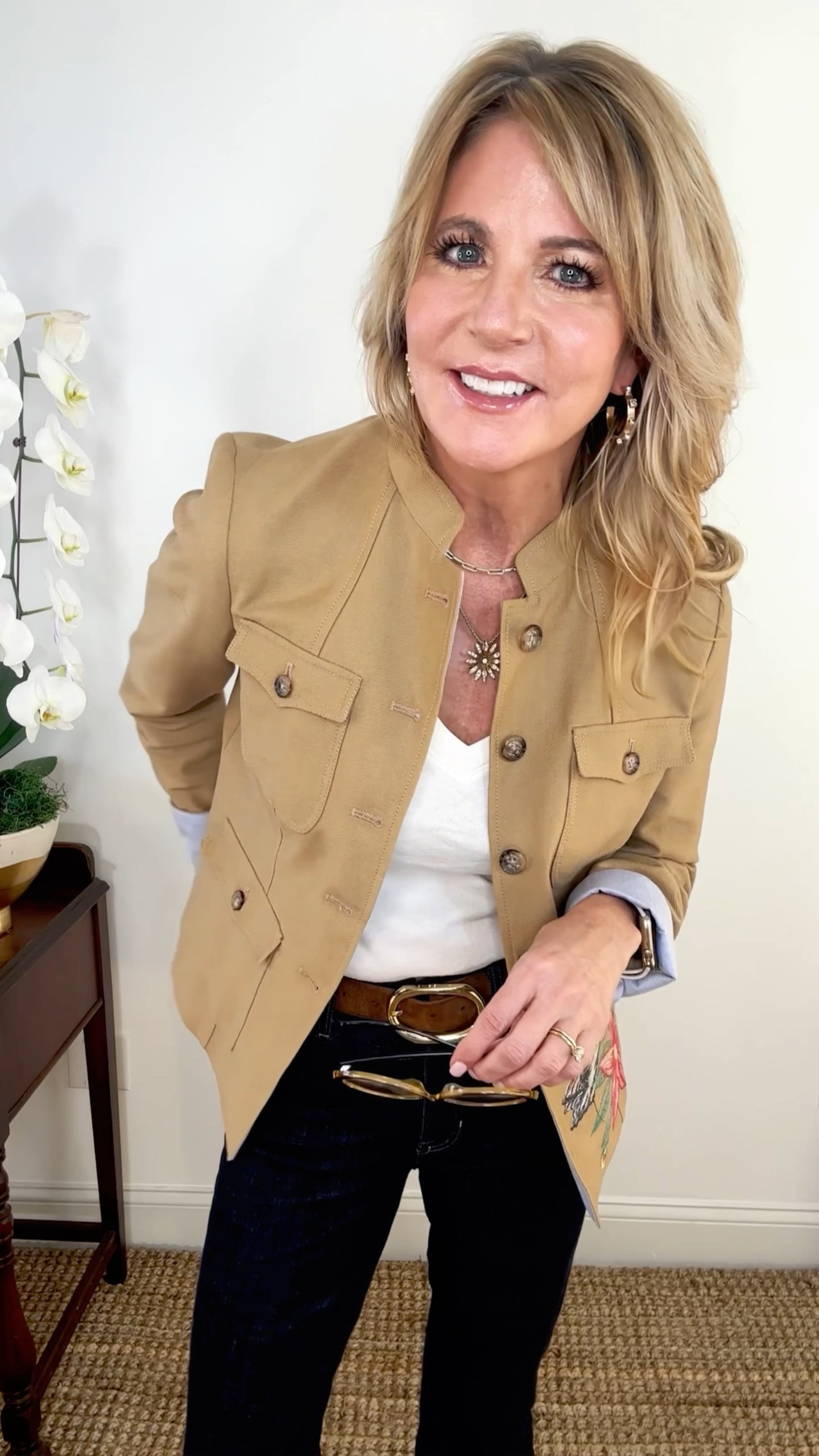 I always like to find a special piece of clothing when I travel. Hopefully something that is classic and timeless. When I saw this blazer on a recent trip to Switzerland, I knew this was the piece. 

I love a blazer year round, and especially khaki in the Spring. This one has a military construction to it. Although I can’t link this exact one, I have found some that are very similar. 

My tee is by L’Agence. It runs on the small side. I always recommend buying good quality base layers. 

My jeans are a dark rinse, skinny flare by JCrew. This rinse is perfect for going out because it lends itself to being more dressy. 

With the jeans and tshirt as a base layer, you can then mix and match belts, shoes, blazers, sweaters, etc. Start with your basics, then build out from there. 

My belt is Anine Bing. It looks great with brown suede shoes. My booties are sold out, but I have found some that are almost identical  

#LTKVideo #LTKover40 #LTKstyletip