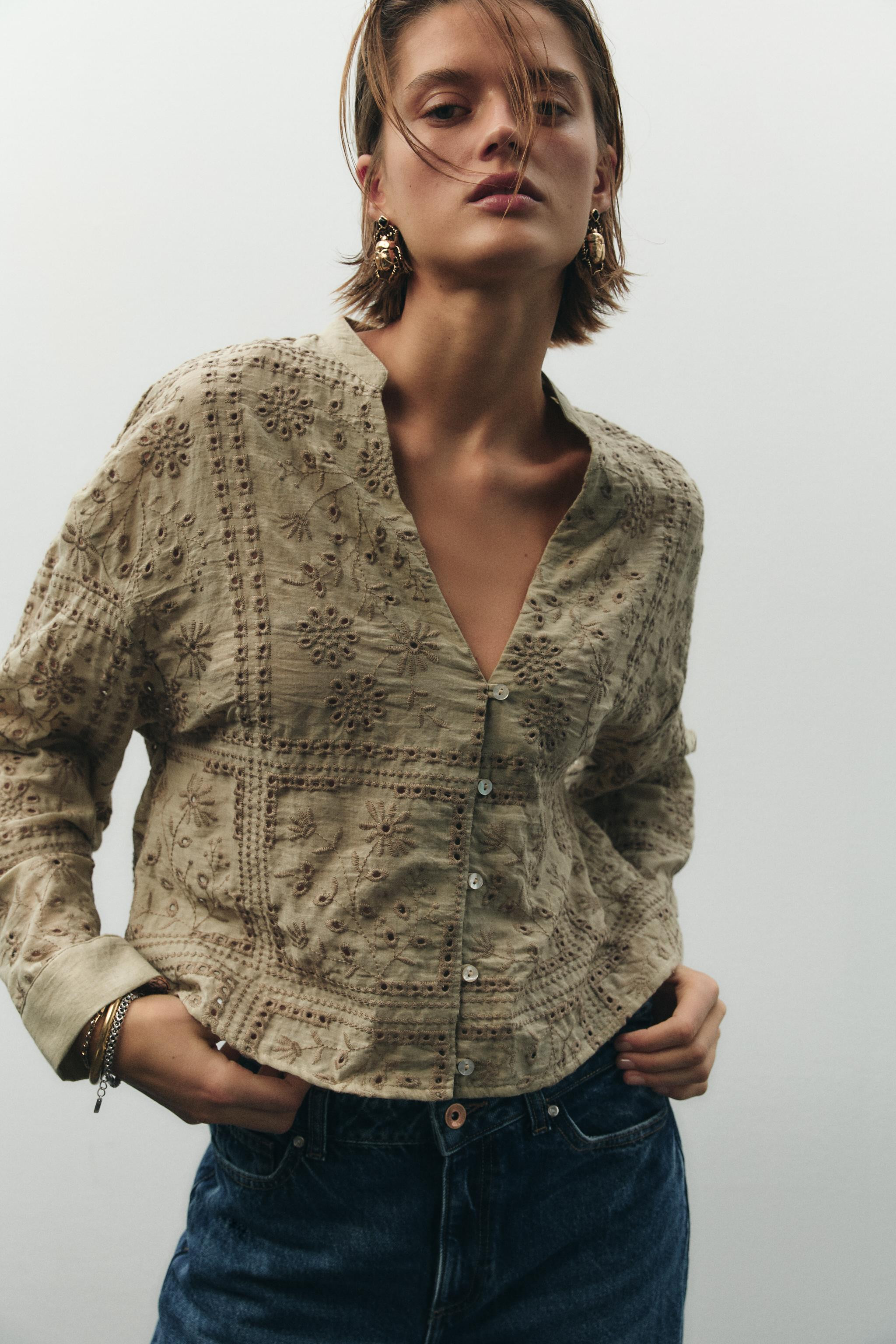 Round neck shirt with V-neckline and long sleeves. Eyelet embroidery detail. Front button closure... | Zara US