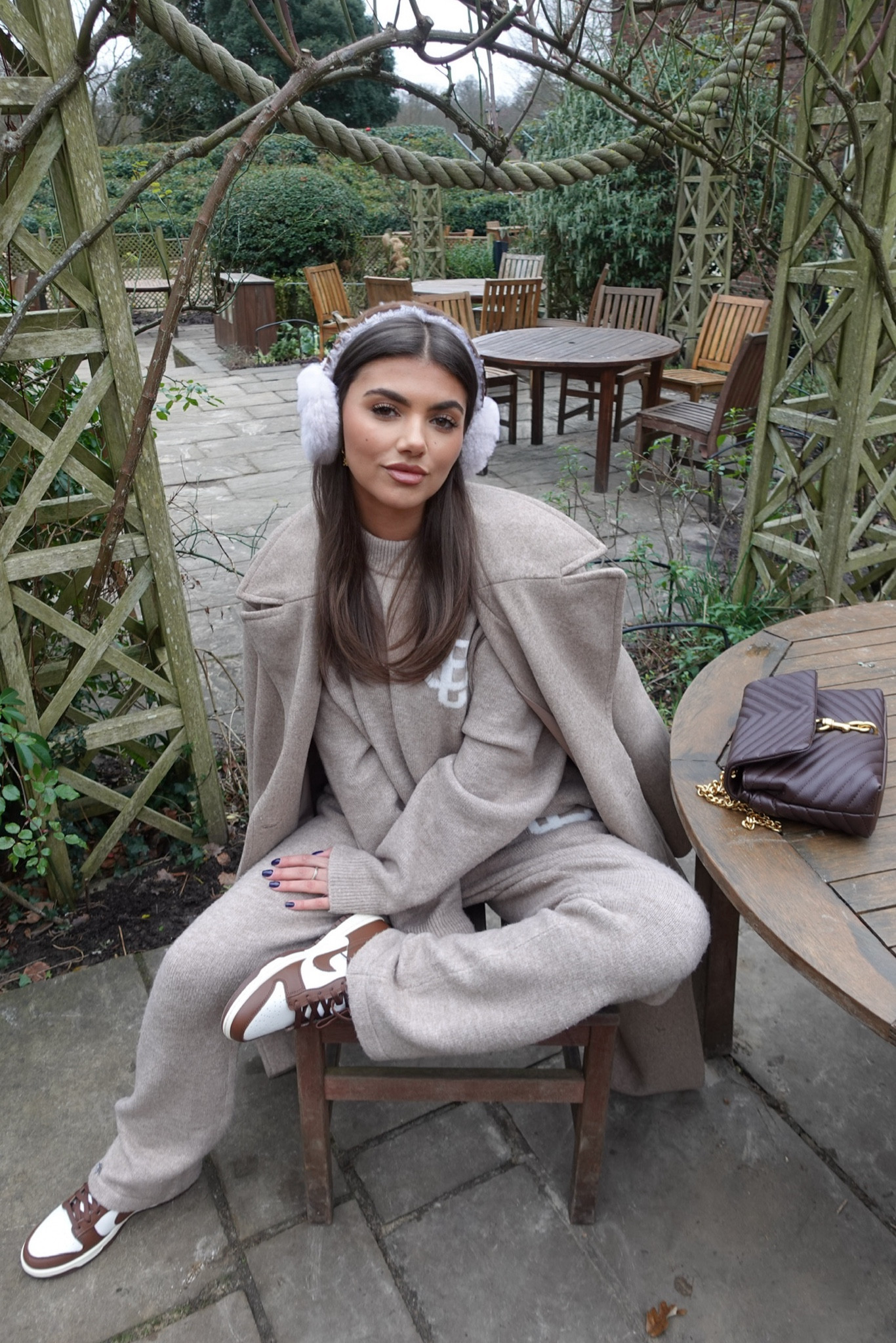 Neutral outfit, cosy outfit winter styling, brown Nike Dunks, couture club knitted set, knitted jumper and trousers, Nike dunks, fluffy ear muffs, brown bag, neutrals 

#LTKeurope #LTKSeasonal #LTKstyletip