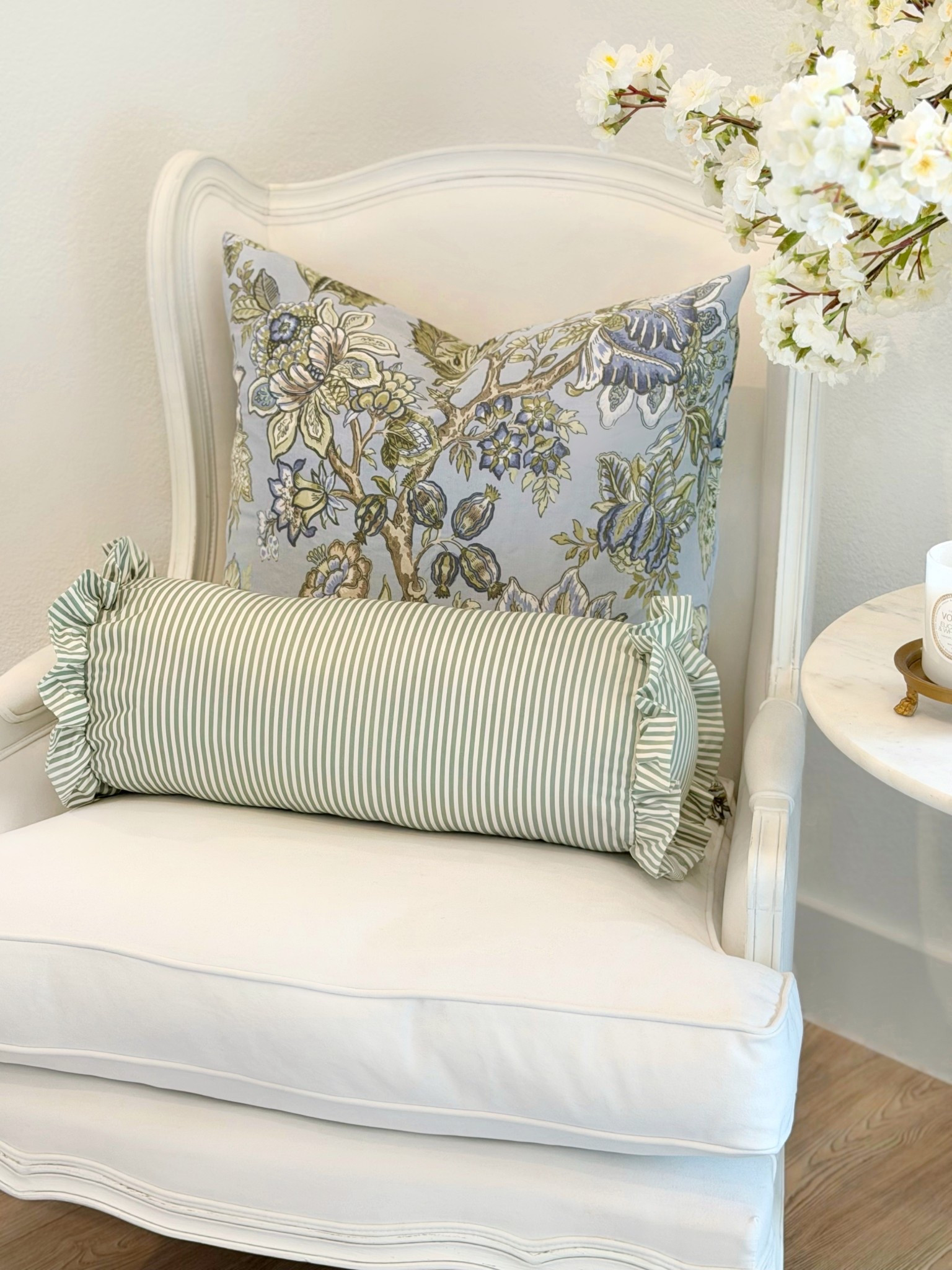 Under $10 bolster pillow 😍 also comes in blue and pink and in a larger size!✨ green pillow ruffle bolster spring pillows  @walmart finds white chair spring decor 