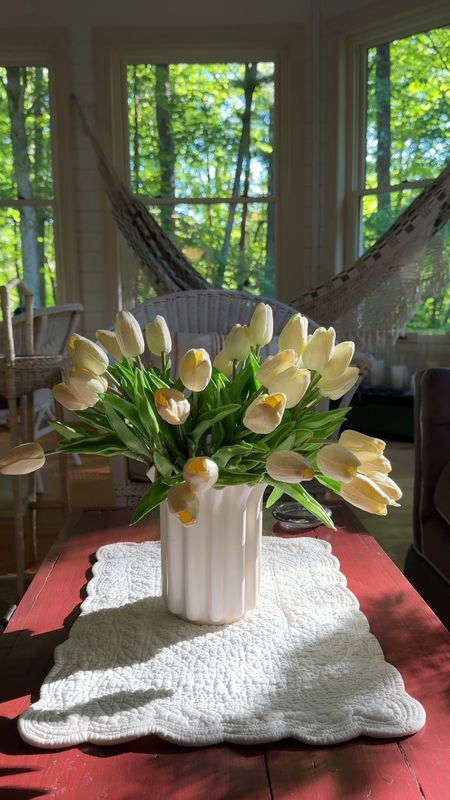 Current porch vibes. I walked by the porch this morning and couldn’t help but notice how pretty the tulips looked as the summer morning sun came through the screen porch windows. The flower vase is vintage. There are 42 tulip stems in this vase 😉  
kimbentley, home decor, tulips, wedding decor,

#LTKHome #LTKSeasonal #LTKVideo