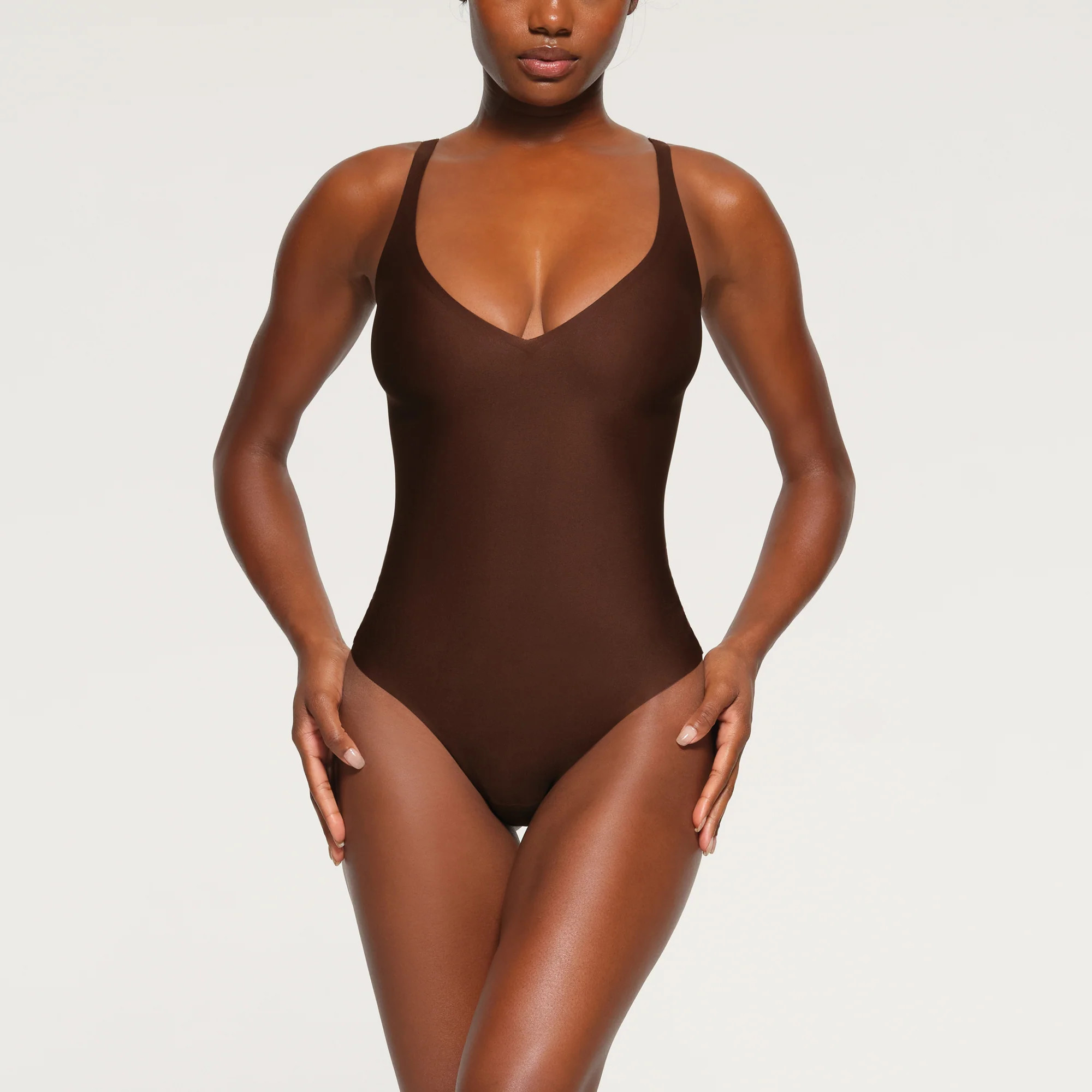 SKIMS Unlined Plunge Thong Bodysuit | Deep Neutral | Medium | SKIMS Body | SKIMS (US)