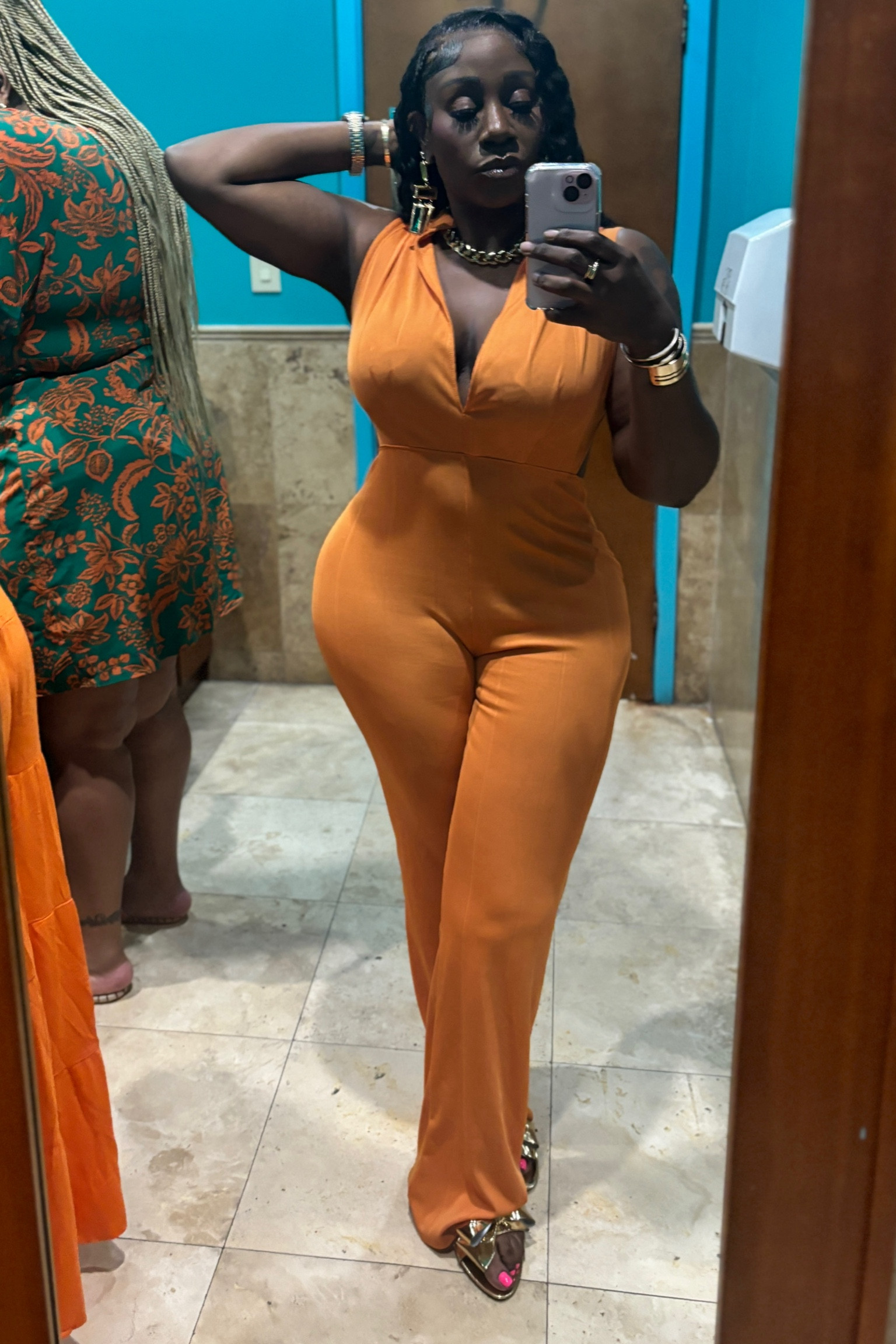 Orange backless jumpsuit 

#LTKtravel #LTKmidsize #LTKstyletip