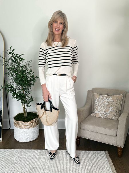 A lightweight striped sweater and a comfy pair of trouser pants can go from the office to an evening out.  

Wearing a size medium in sweater, size 6 in trousers.  Shows run true to size.  

#LTKSeasonal #LTKOver40 #LTKStyleTip