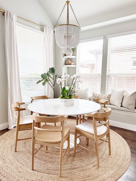 Breakfast room with white tulip modern table 

#LTKFind #LTKhome #LTKstyletip