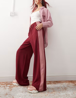 Reclaimed Vintage wide leg trouser with side contrast panel in burgundy | ASOS (Global)
