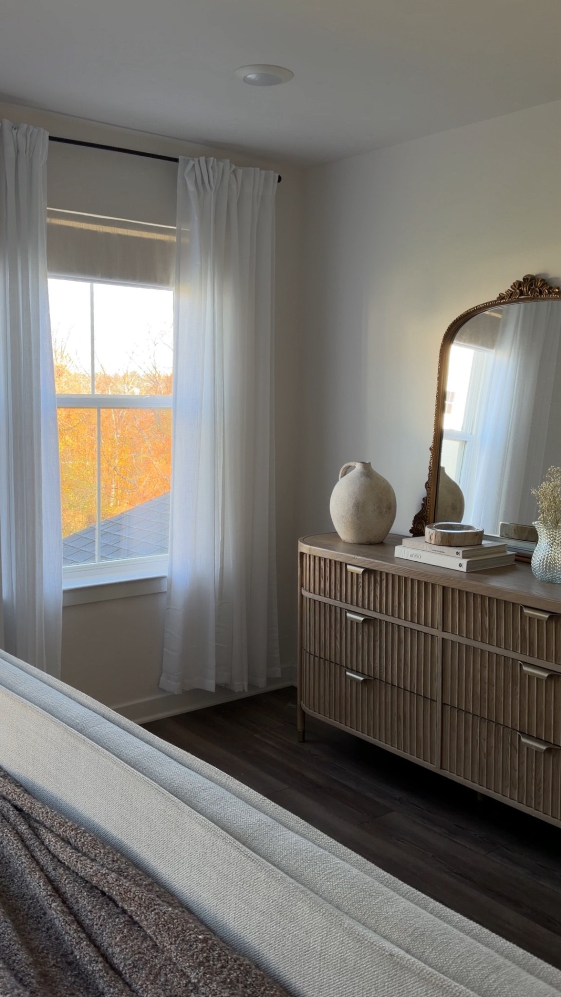 11/2/25 Sharing our cozy, neutral master bedroom setup ✨ Linking our fluted dresser and gleaming primrose mirror from Anthropologie — my two favorite statement pieces — along with our Amazon Roman shades and white linen curtains that bring in the softest morning light. Simple, timeless, and cozy. 🕯️


#LTKHome #LTKStyleTip