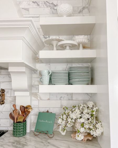 I added little touches of green throughout my kitchen including the utensil crocks, a cookbook set up on an easel, and I arranged some faux apple blossoms in a green and white floral vase.

#LTKfamily #LTKSeasonal #LTKhome