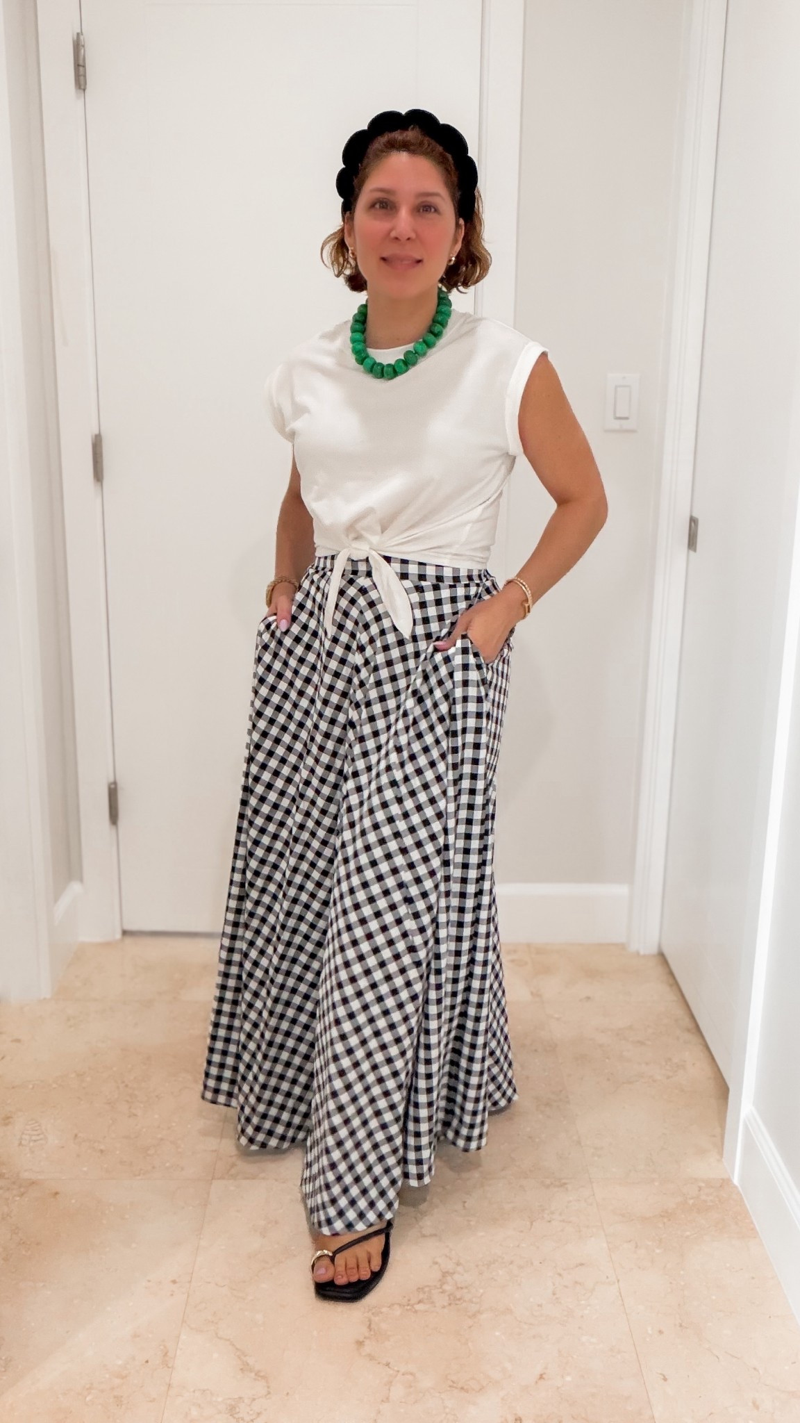 Great gingham pleated skirt available in several colors and versatile crewneck cap sleeve tie front top with baublebar bead necklace. 