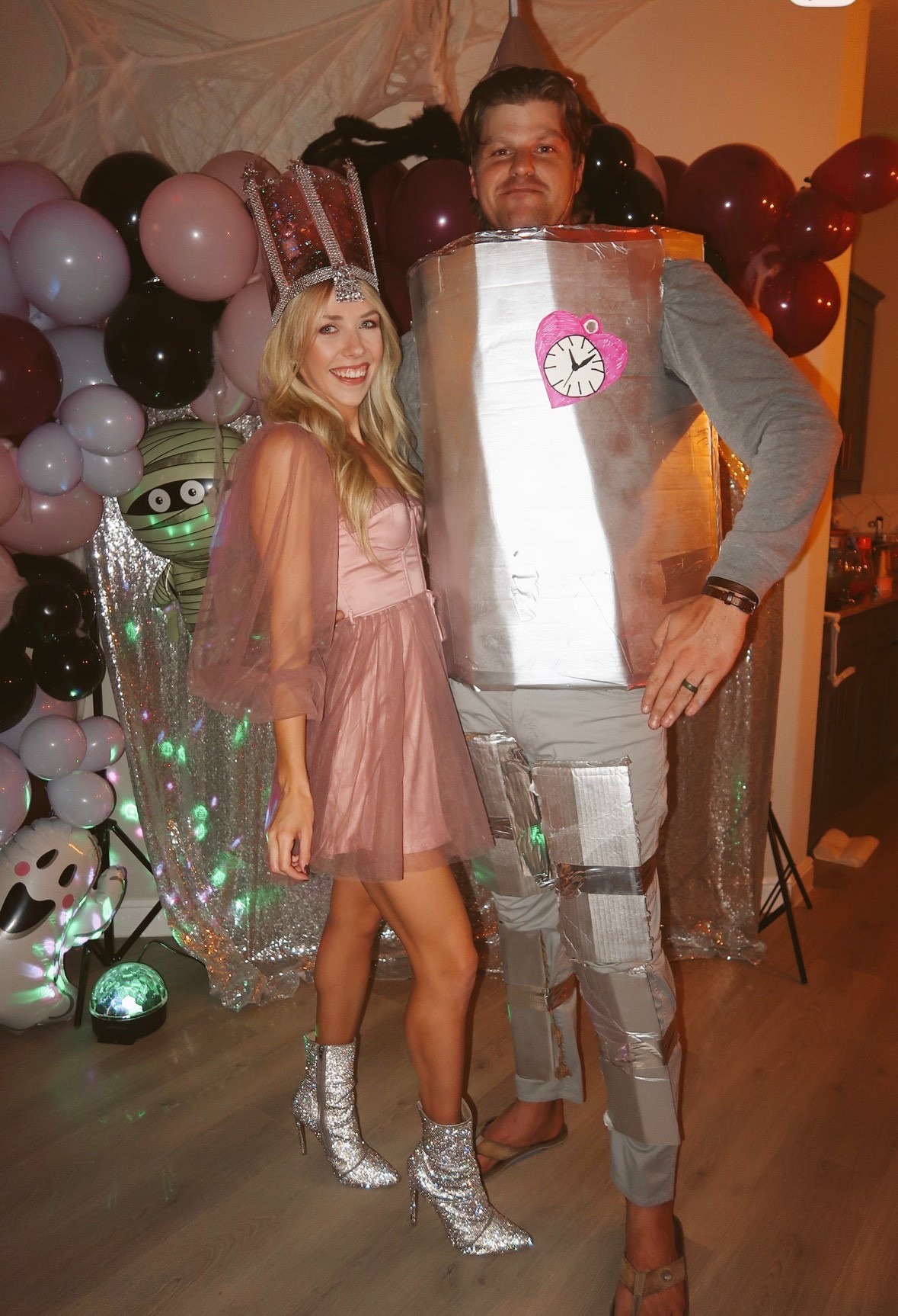 Last years easy diy costume and super on trend for this year! Glinda and the tin man!

For Glinda I made my own crown that I am so proud of! Got a pink dress and put on some sparkly boots 

Andrew wore a gray sweat set and we got a cardboard box, spray painted it, and used a ton of this metallic duct tape to put it on. 

#LTKHalloween #LTKSeasonal