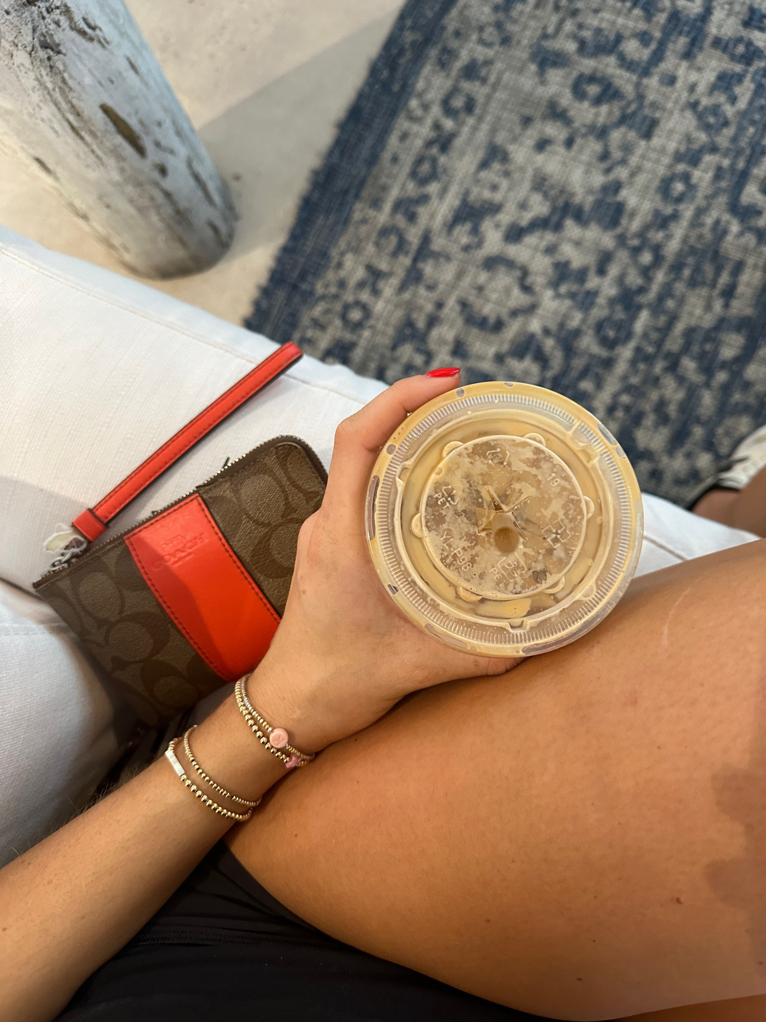 Coach wristlet and gold beaded bracelets 

#LTKtravel #LTKfindsunder100 #LTKGiftGuide