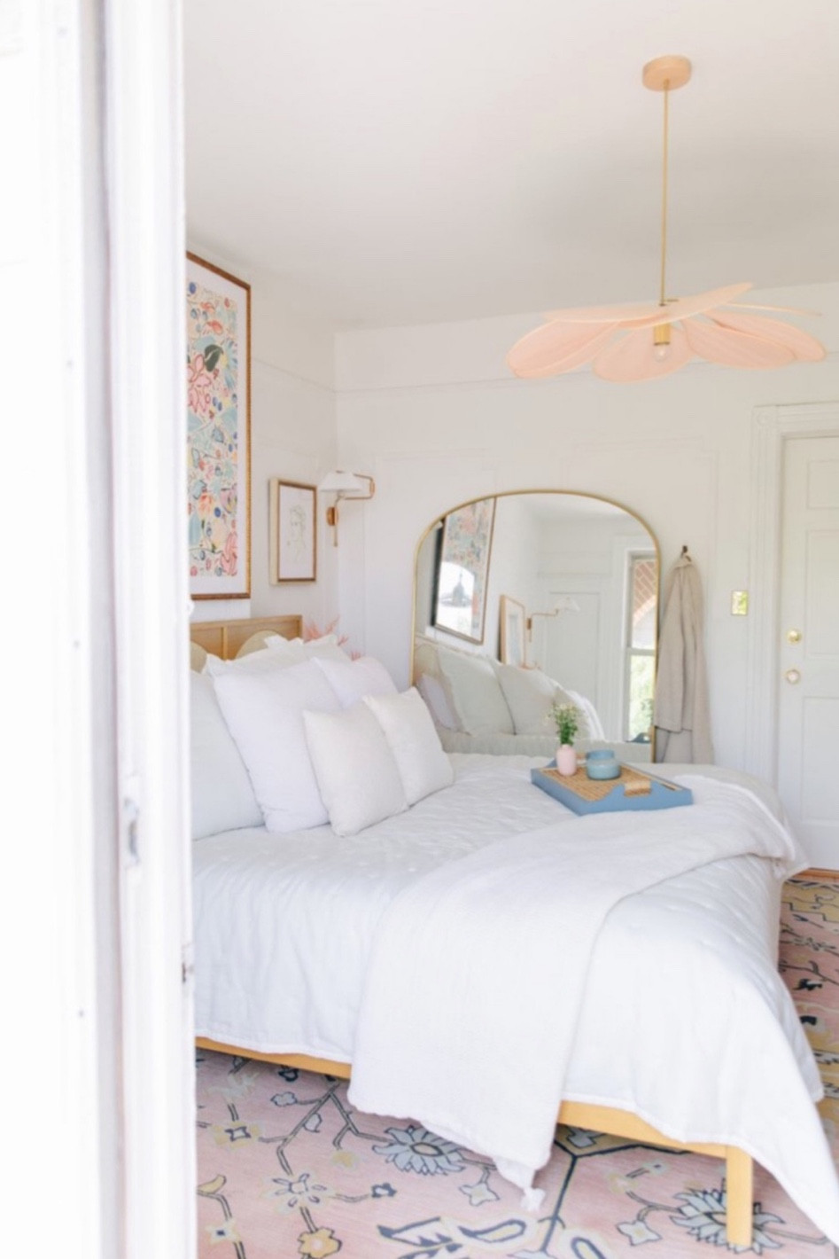 Serene master bedroom with statement chandelier 

#LTKHome