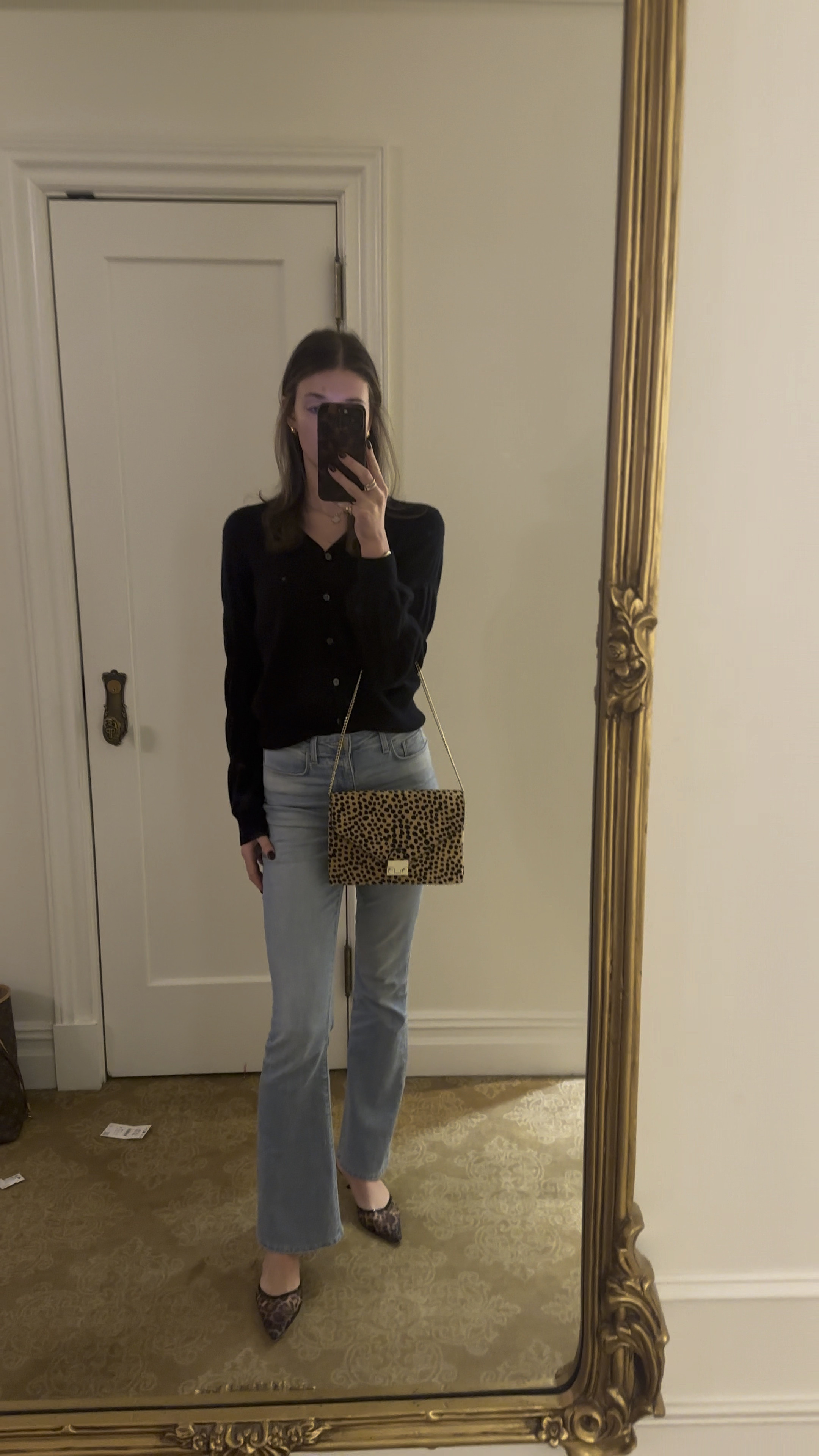 Black button down cardigan and light wash jeans outfit. Bootcut jeans. Leopard print purse. Leopard print mesh heels. Casual outfit. Work outfit. Vacation outfits. Cherry coded. Moto Boho. Minimalist outfits. Capsule wardrobe. Street style. Retro looks. Effortless elegance. Chunky boots. Statement coats. Cozy sweaters. Monochromatic looks. Natural glam. 

#LTKStyleTip #LTKTravel #LTKWorkwear