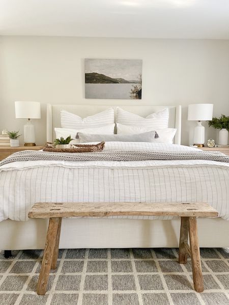 Coastal modern bedroom, upholstered bed on sale!  Bedding, wood bench, nightstand, Loloi rug 

#LTKhome #LTKstyletip
